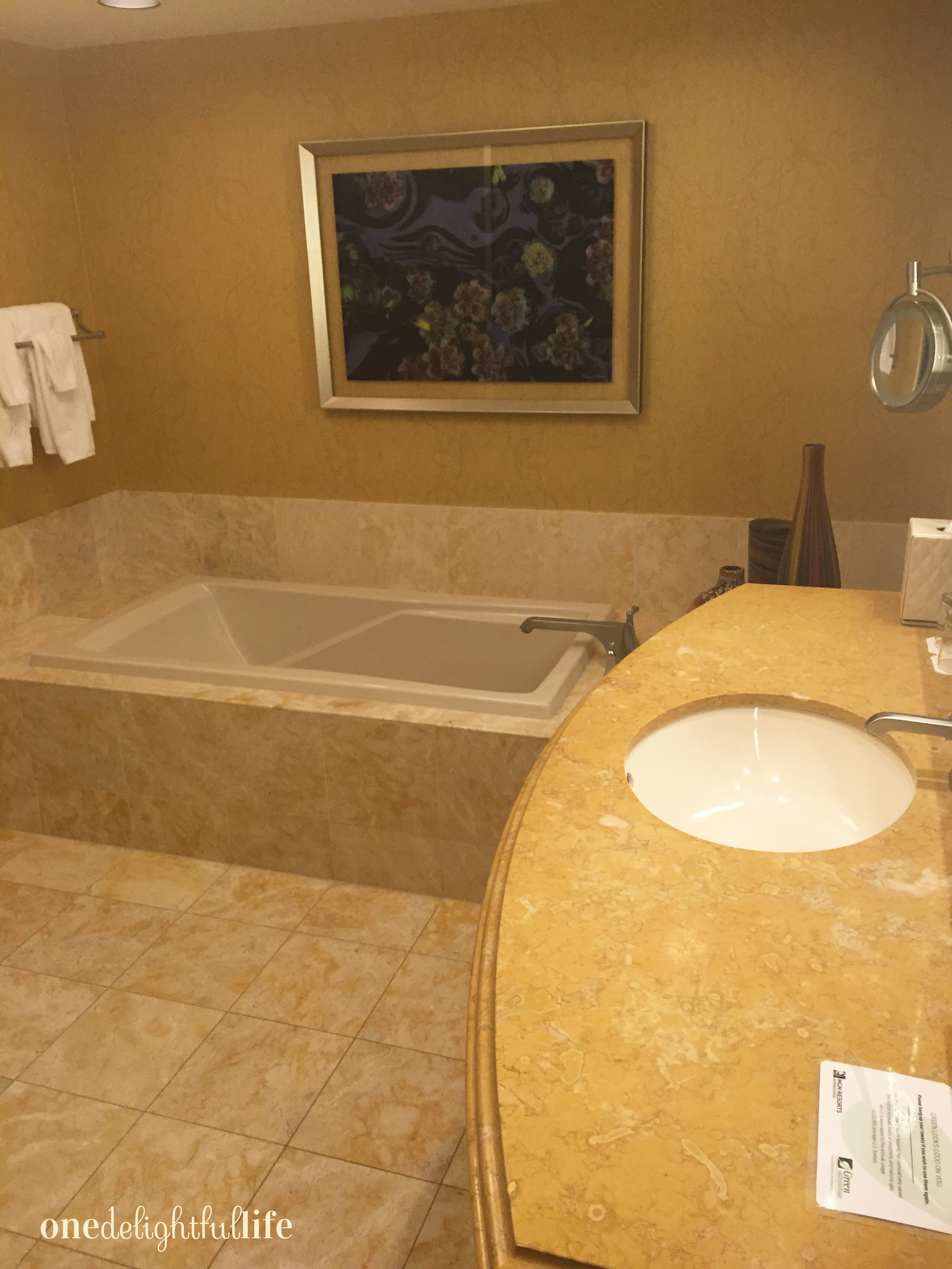 Each bathroom comes with a large glass enclosed shower and deep bathtub.