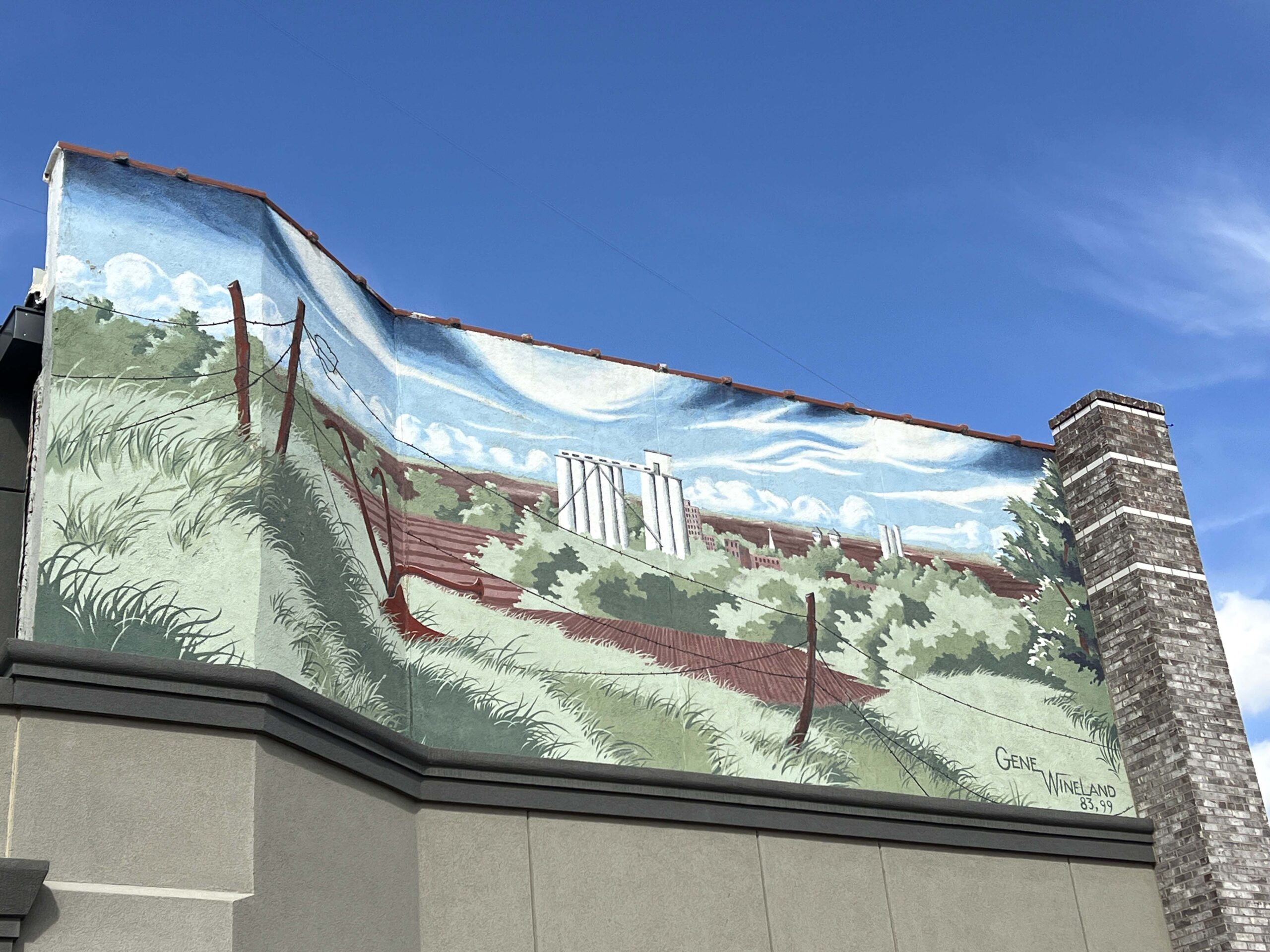 This mural was painted by Gene Wineland in 1983 in downtown Pratt. 