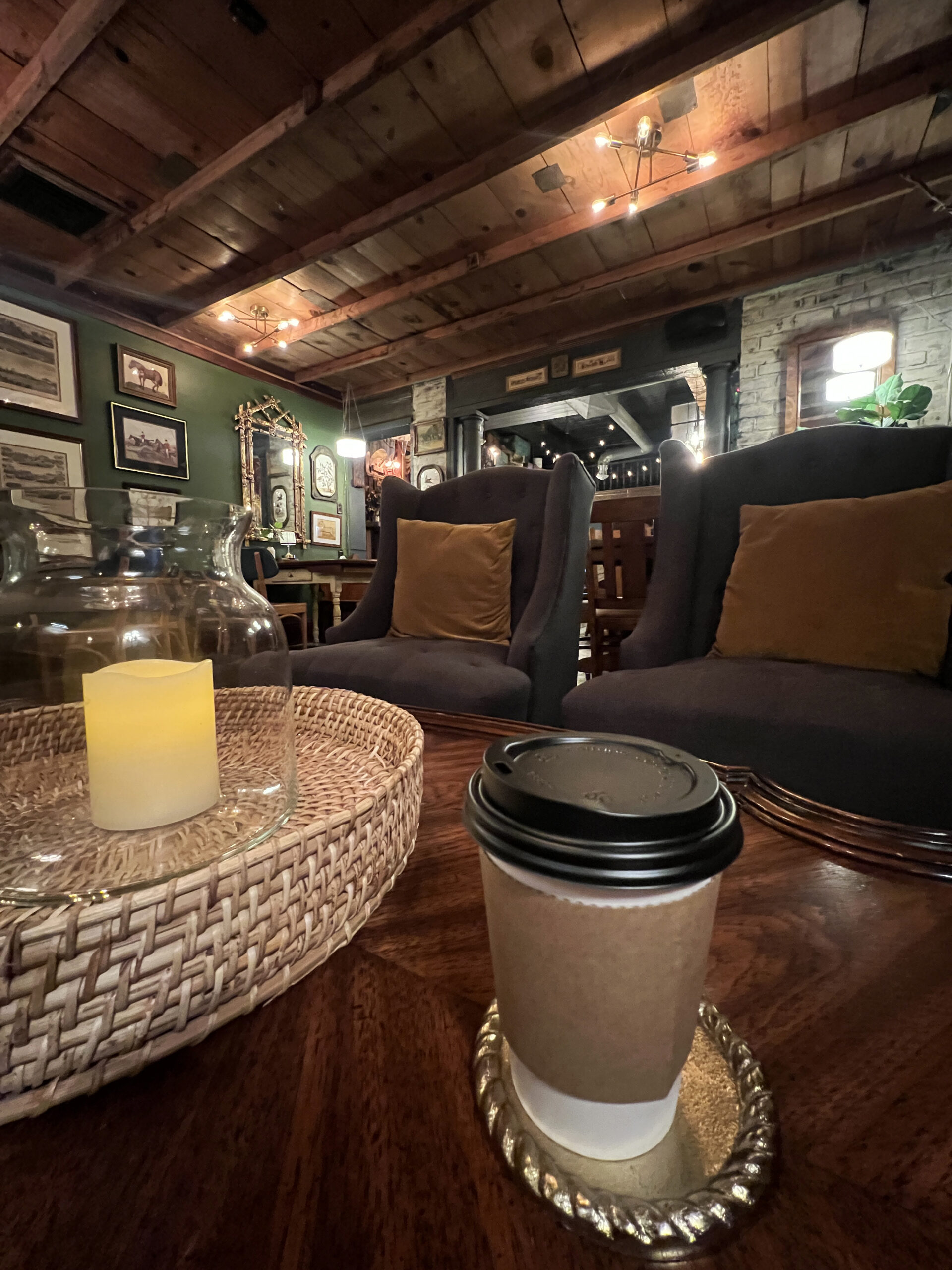 Coffee cup sits on a table in the back of Rhubarb Market at Molly's Mercantile in Hillsboro, Kansas.