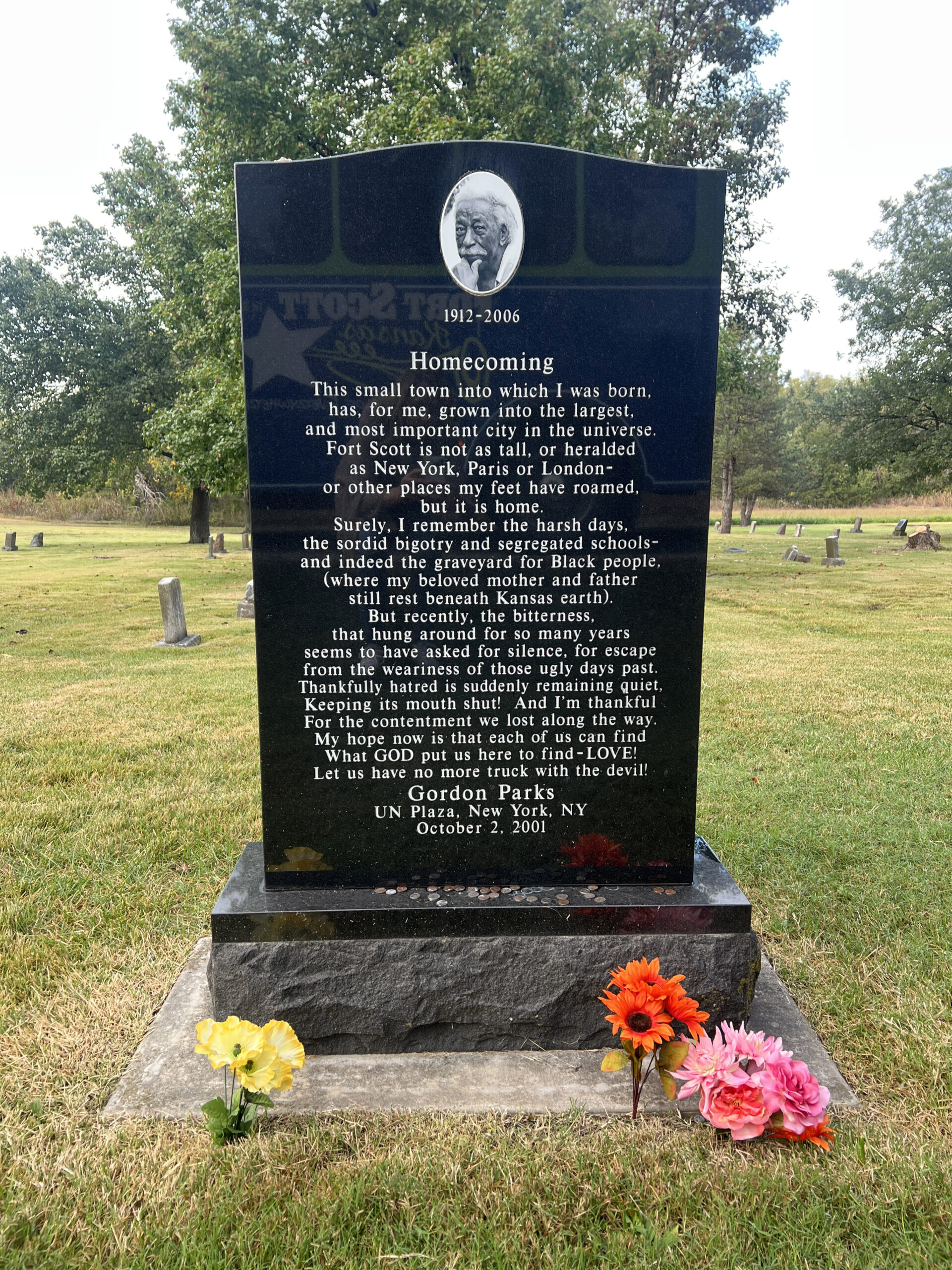 Homecoming Gravesite Memorial for Gordon Parks includes a poem that he wrote, a tribute to his hometown, Fort Scott, Kansas.