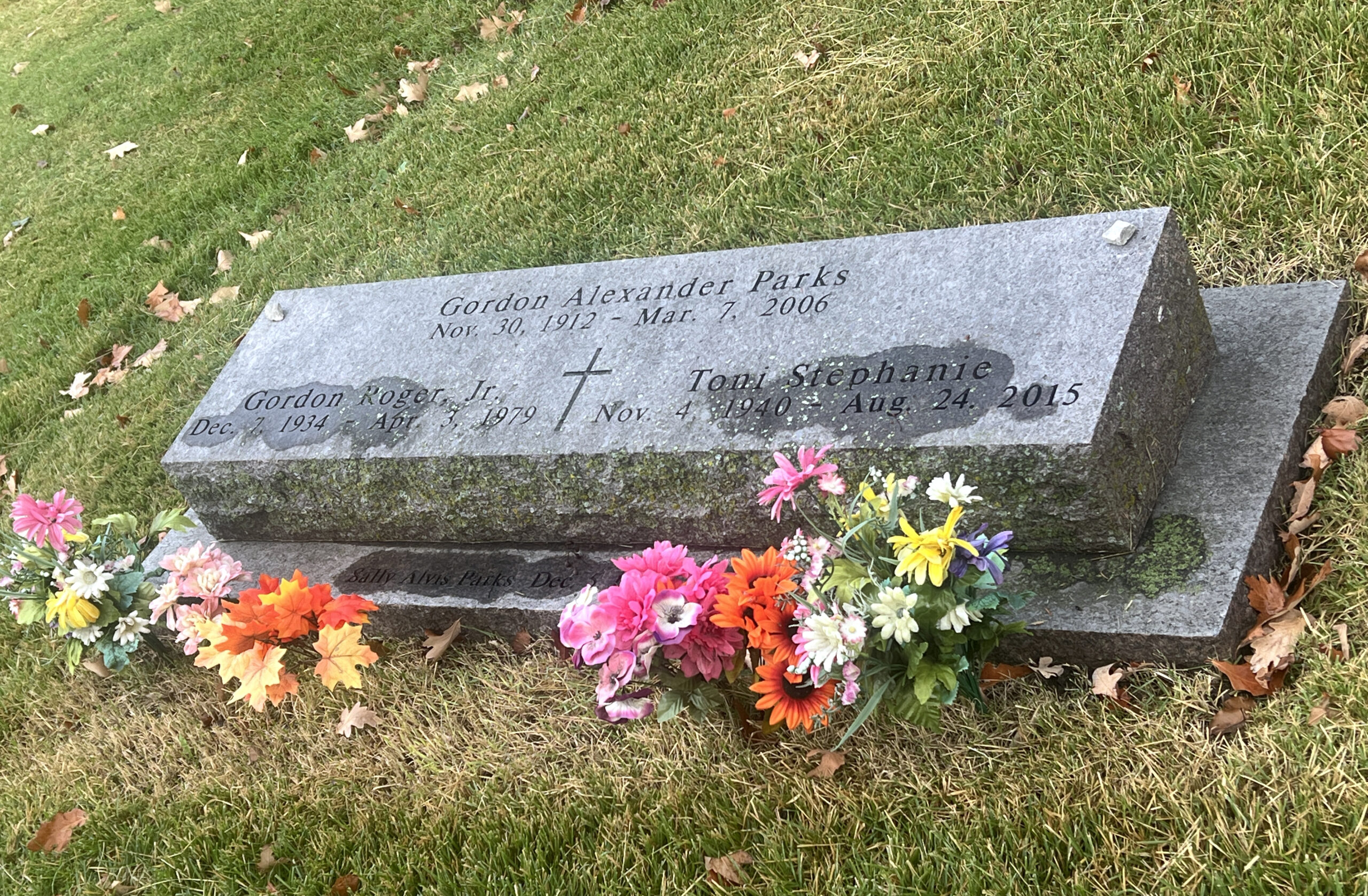 Gordon Parks gravesite includes a second memorial engraved with a poem he wrote, Homecoming. 