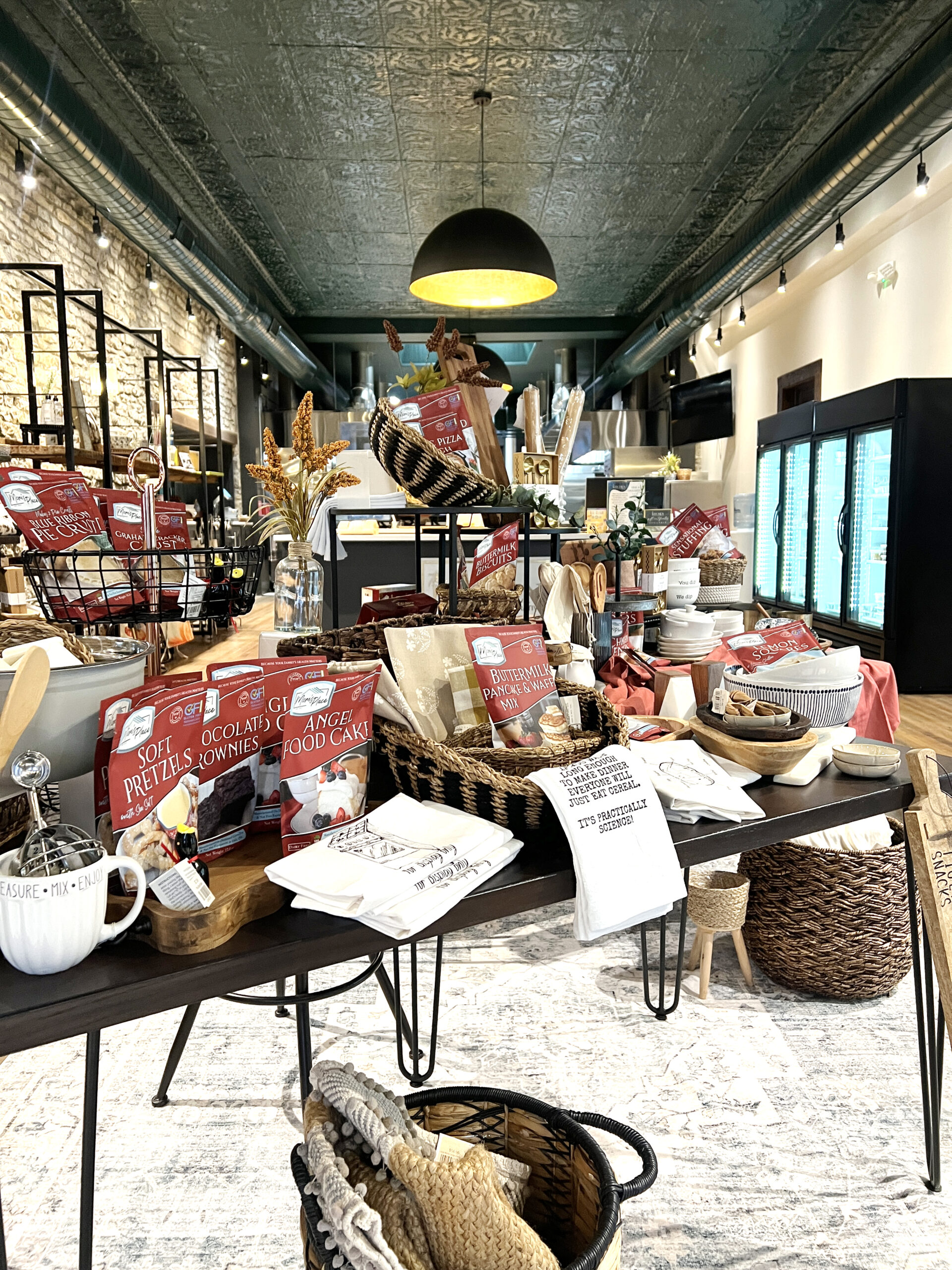 The Kitchen Collective and Collaborative's retail section features kitchenware and a selection of home decor items. 