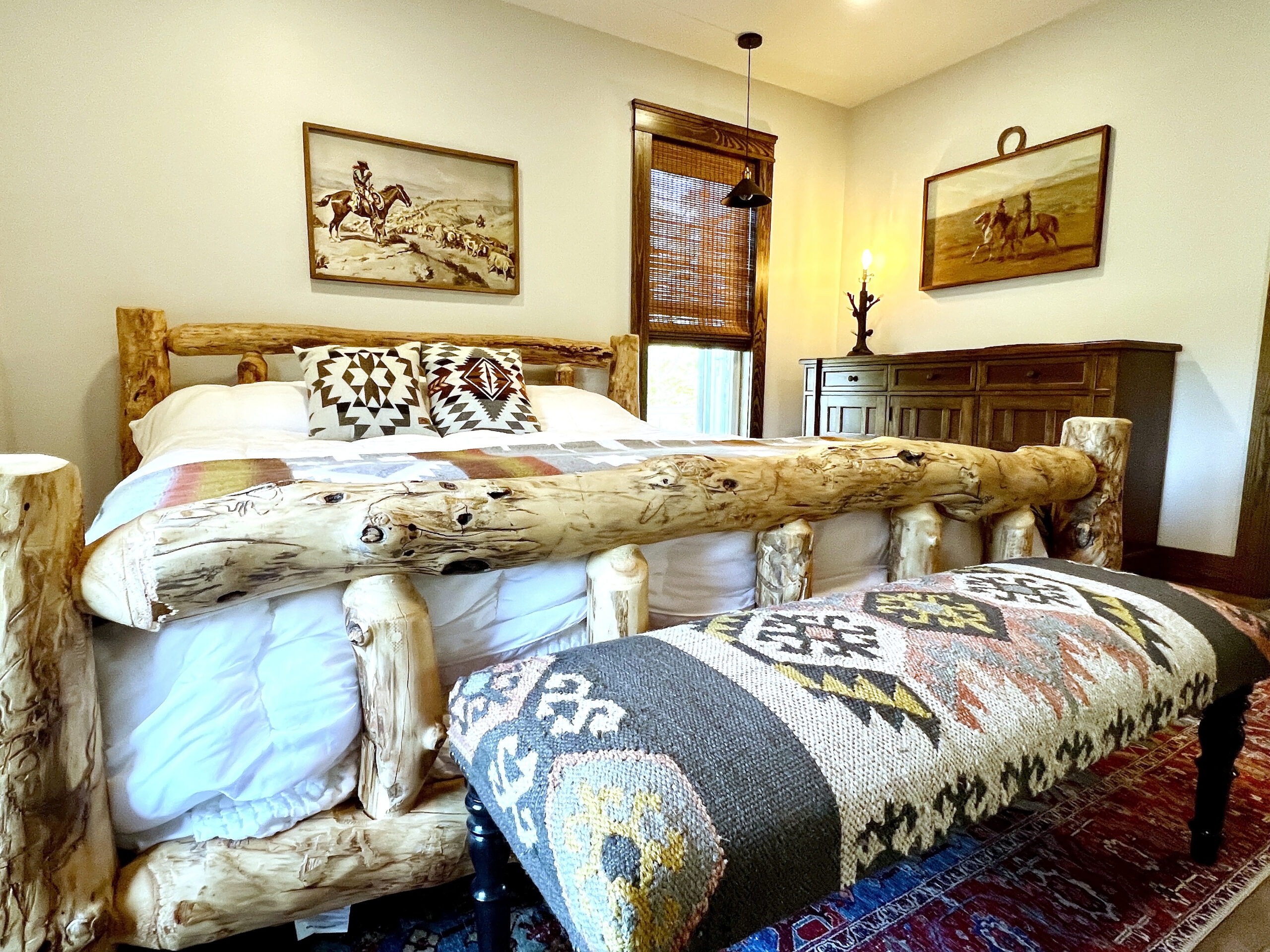 Bedroom 1 has a plush king mattress and a private bathroom with soaker tub and heated floors.