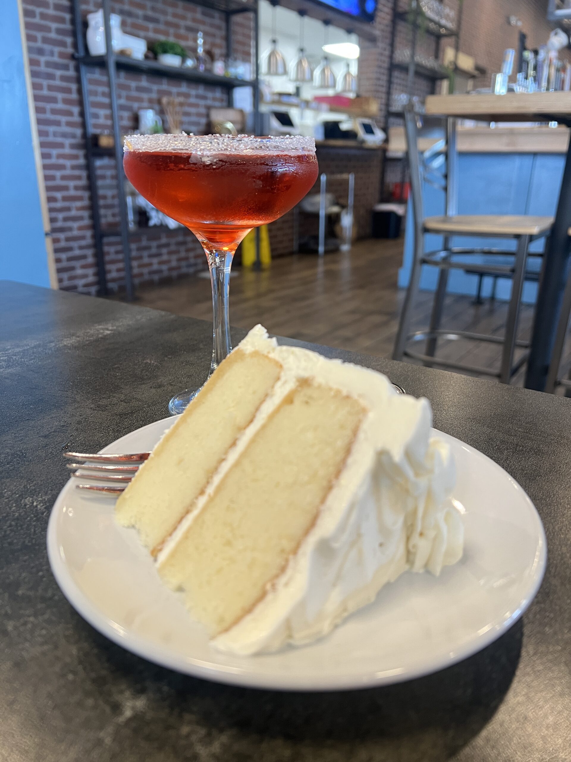 White Wedding Cake and a martini make a sweet duo at The Kitchen, which is known for its Cake of the Month feature, with some of the proceeds going to a local non-profit organization.