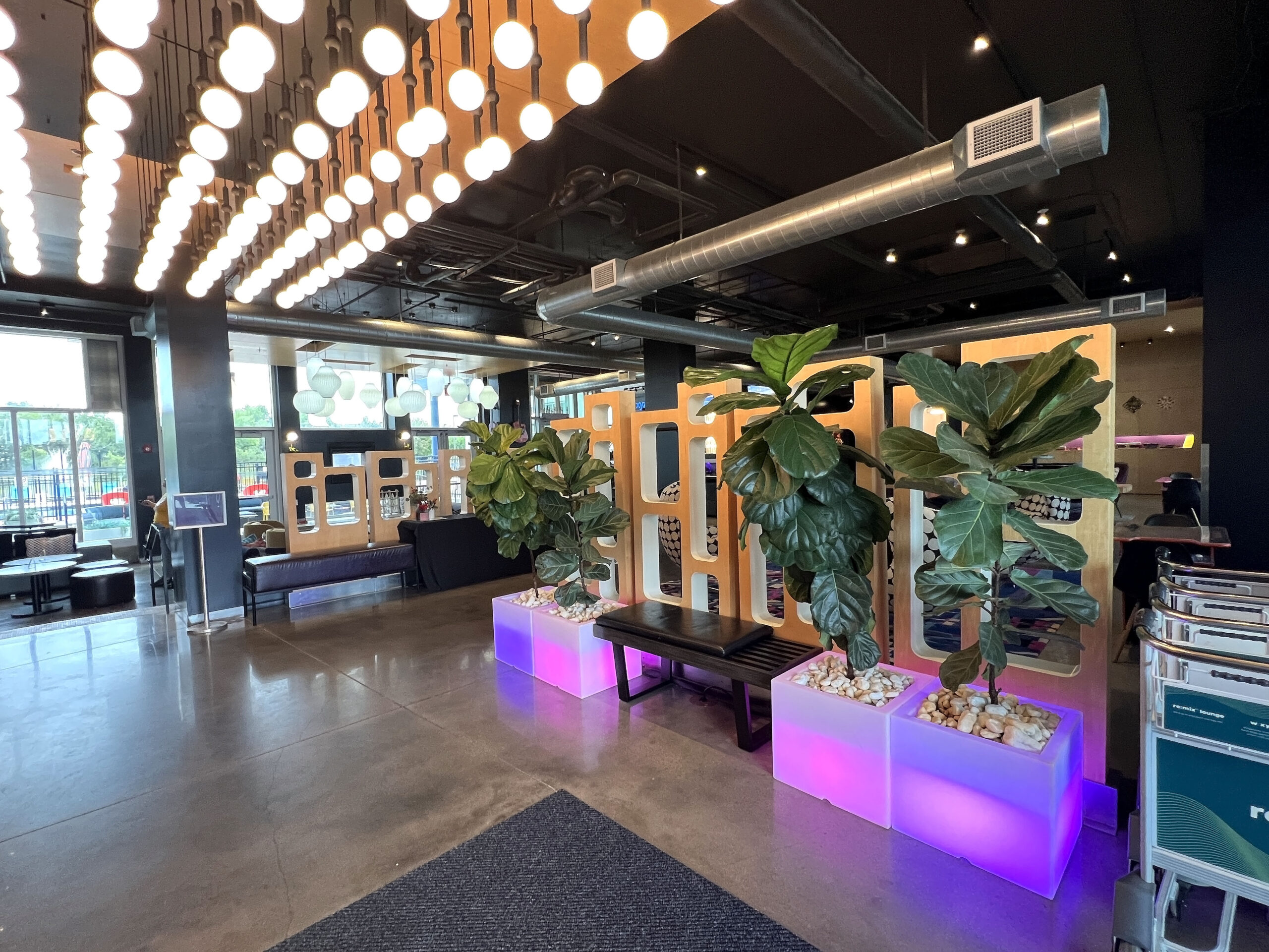 Aloft Wichita lobby entrance is decorated with hip, modern furniture and light fixtures. 