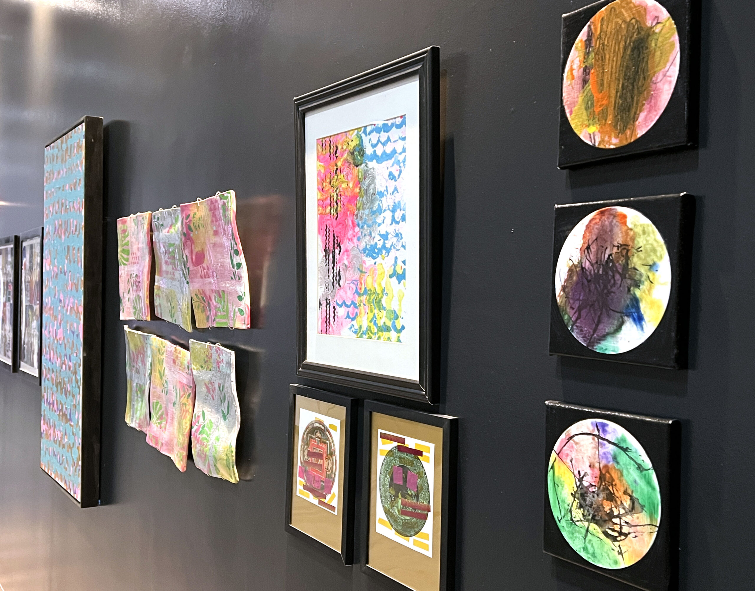 Envision artists' works are displayed in the hallway at Aloft Wichita. 