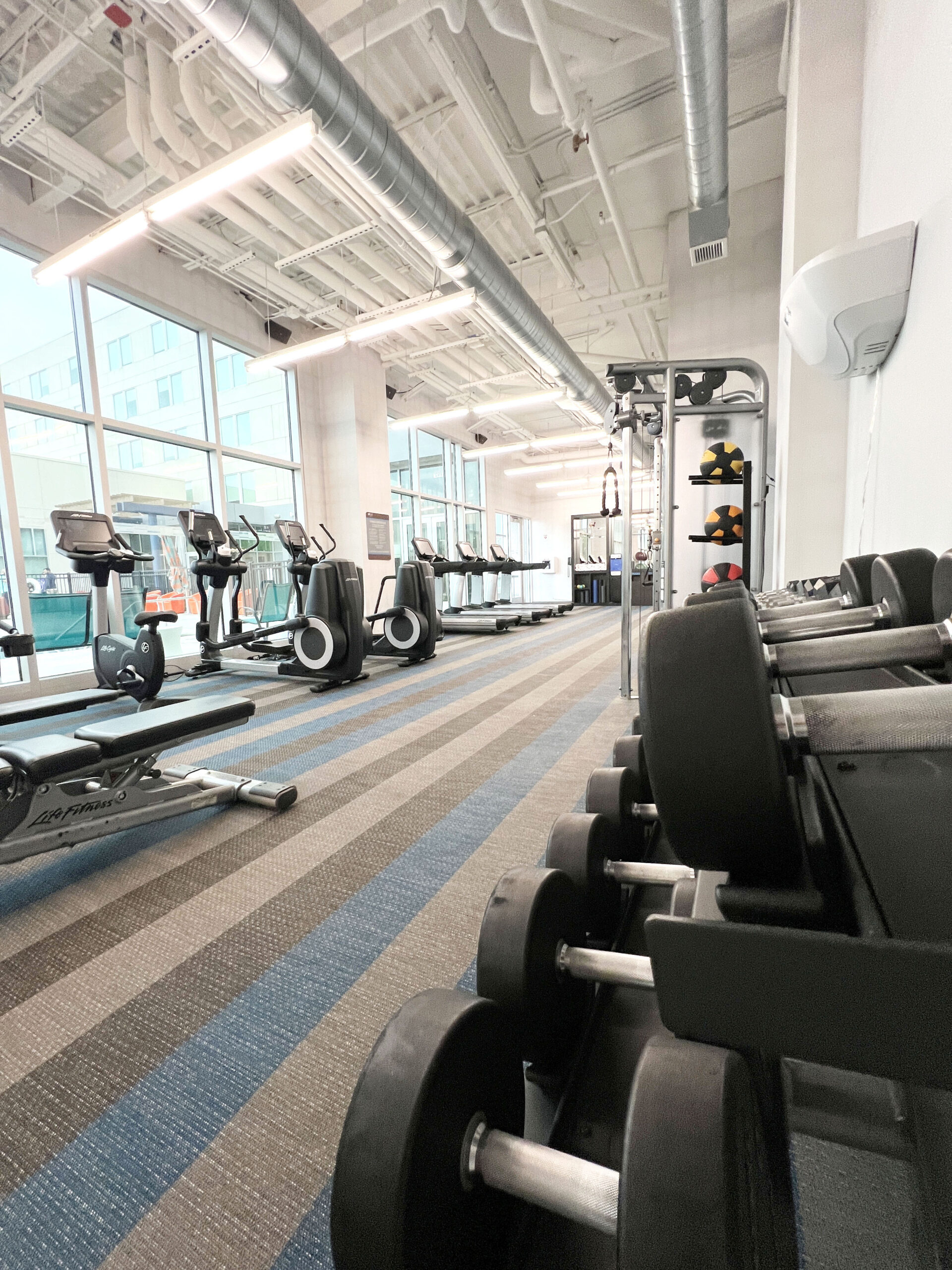 The fitness centers includes a water refill station and a variety of workout equipment. 