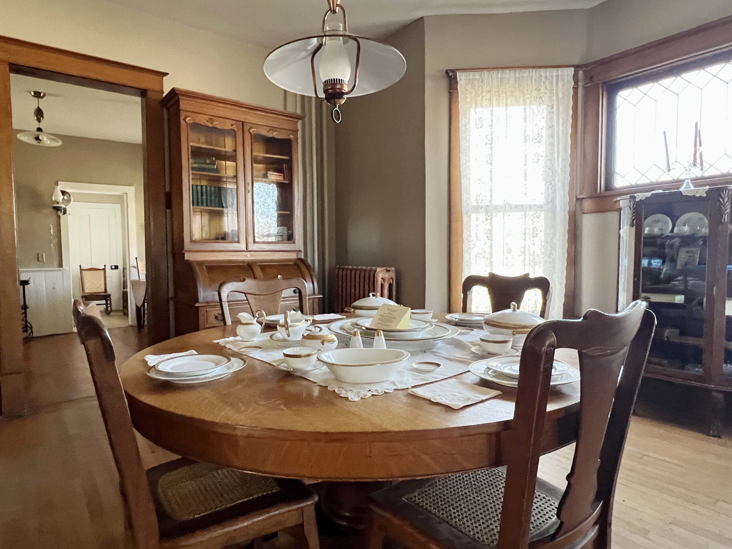 The family dining table includes gold-plated china used by the Miner family.