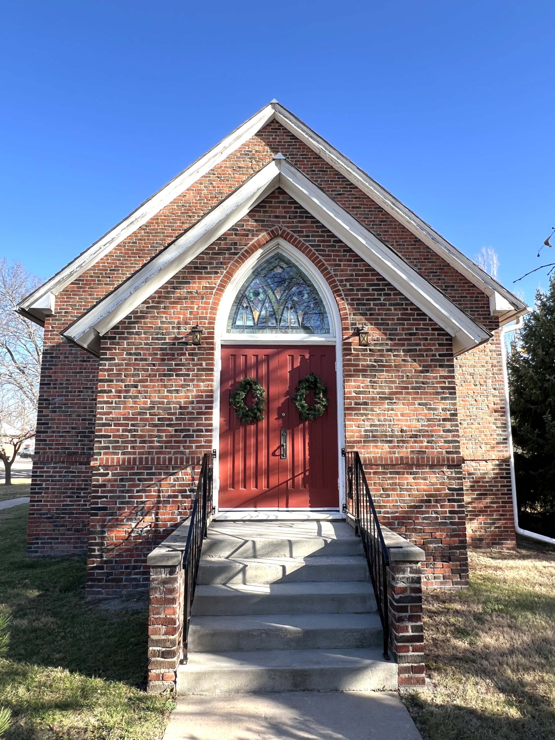 Grace Episcopal Church includes hand-painted glass windows, Will Cather dedicated to her parents.
