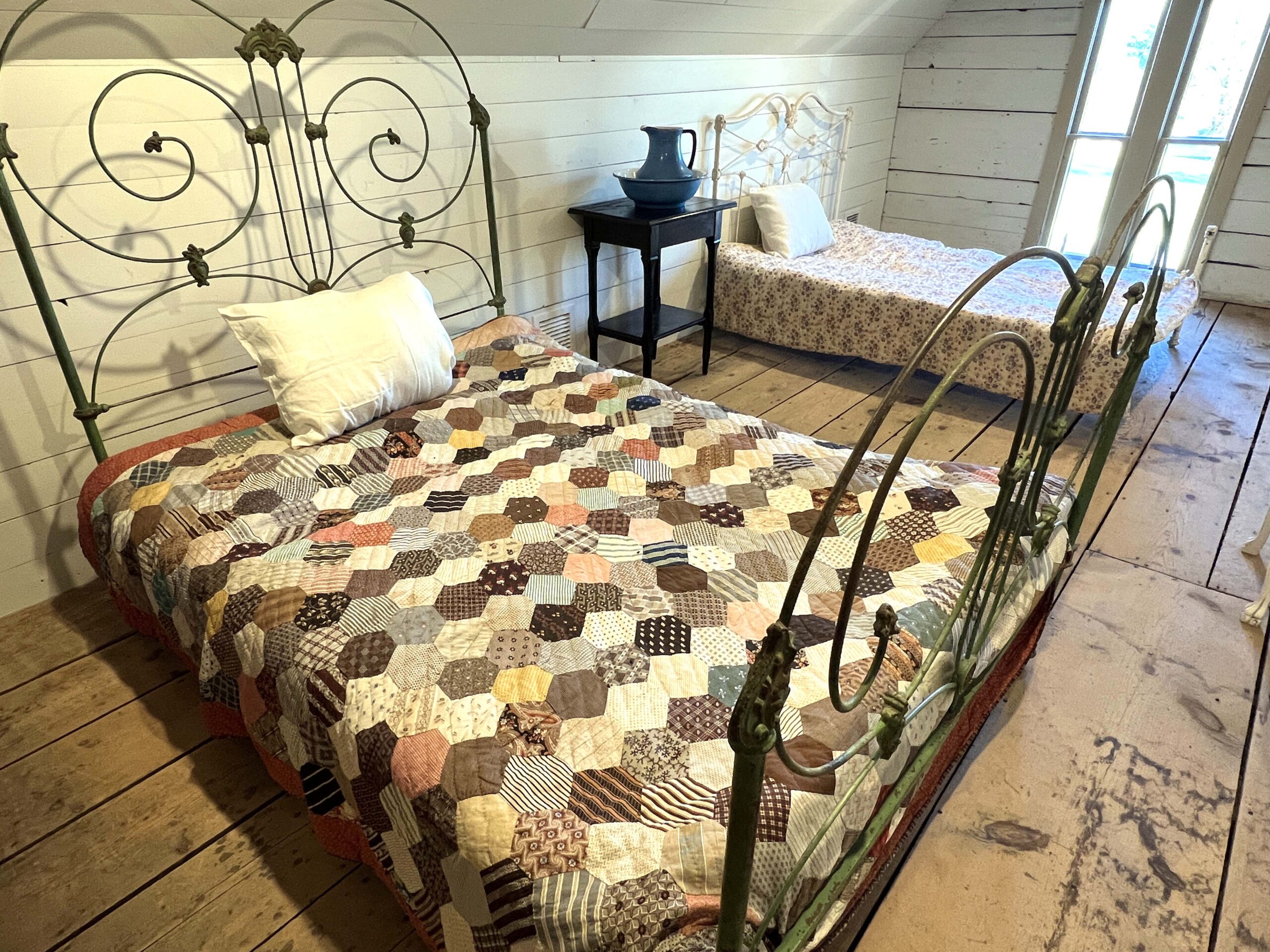 Willa Cather's Childhood Bedroom can't be touched by visitors, but one can see it view the loft's bedroom door.
