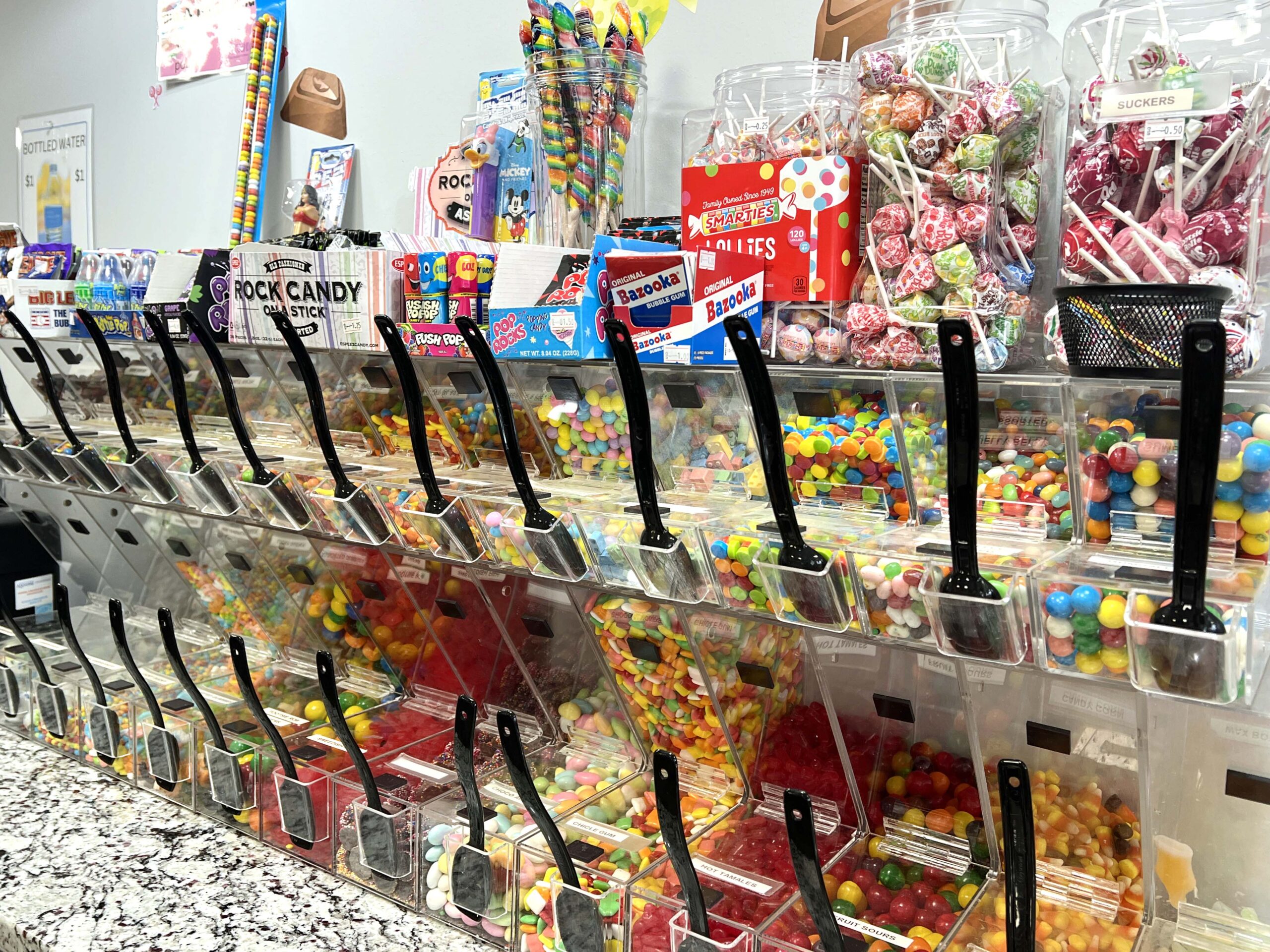 A self-serve candy station, perfect for mixing and matching your favorite sweets by the pound, is available to customers.