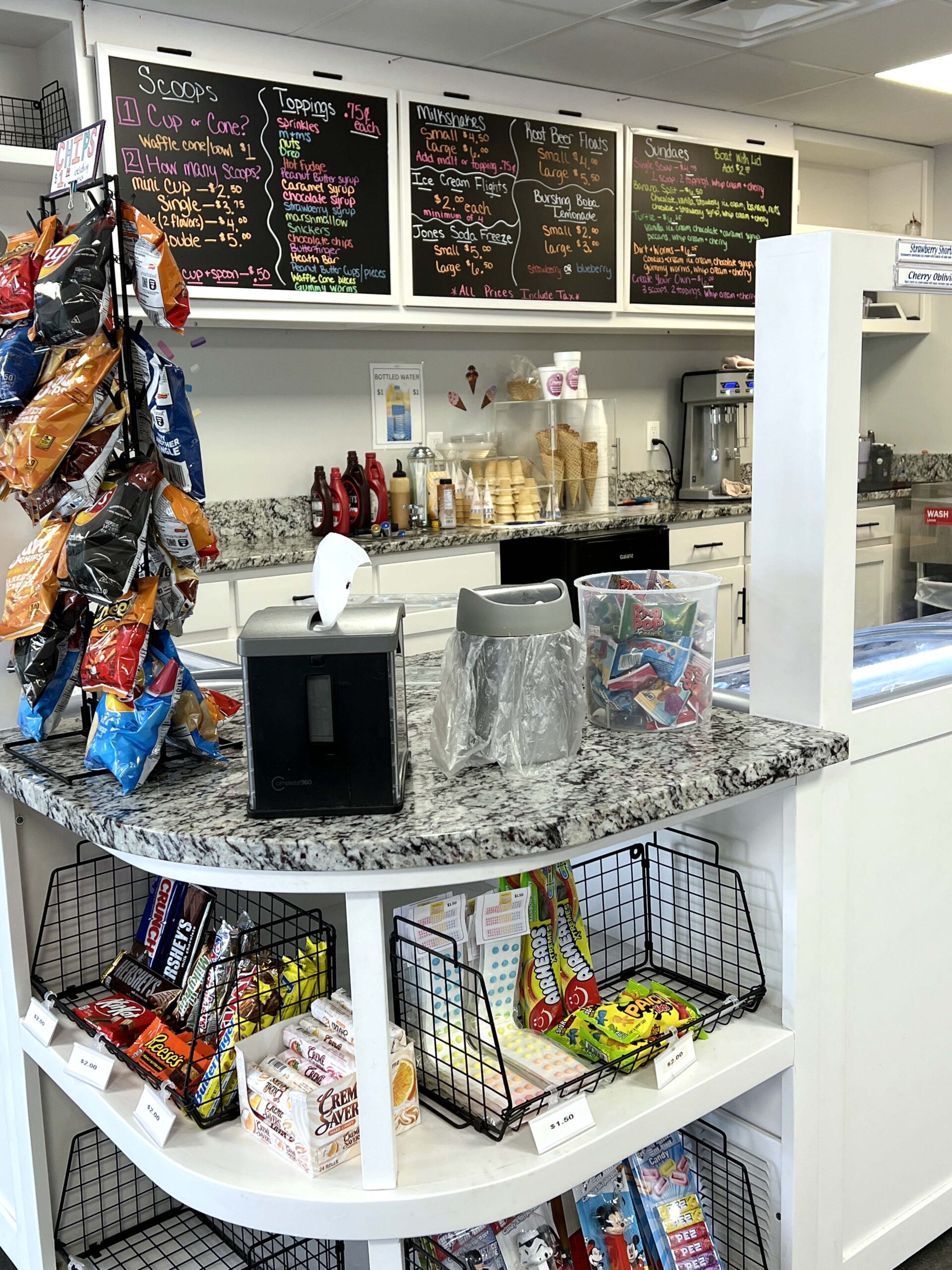 Granny's Chip Chocolate Ice Cream & Candy Shop's menu boards feature ice cream available by the scoop or used in shakes. 