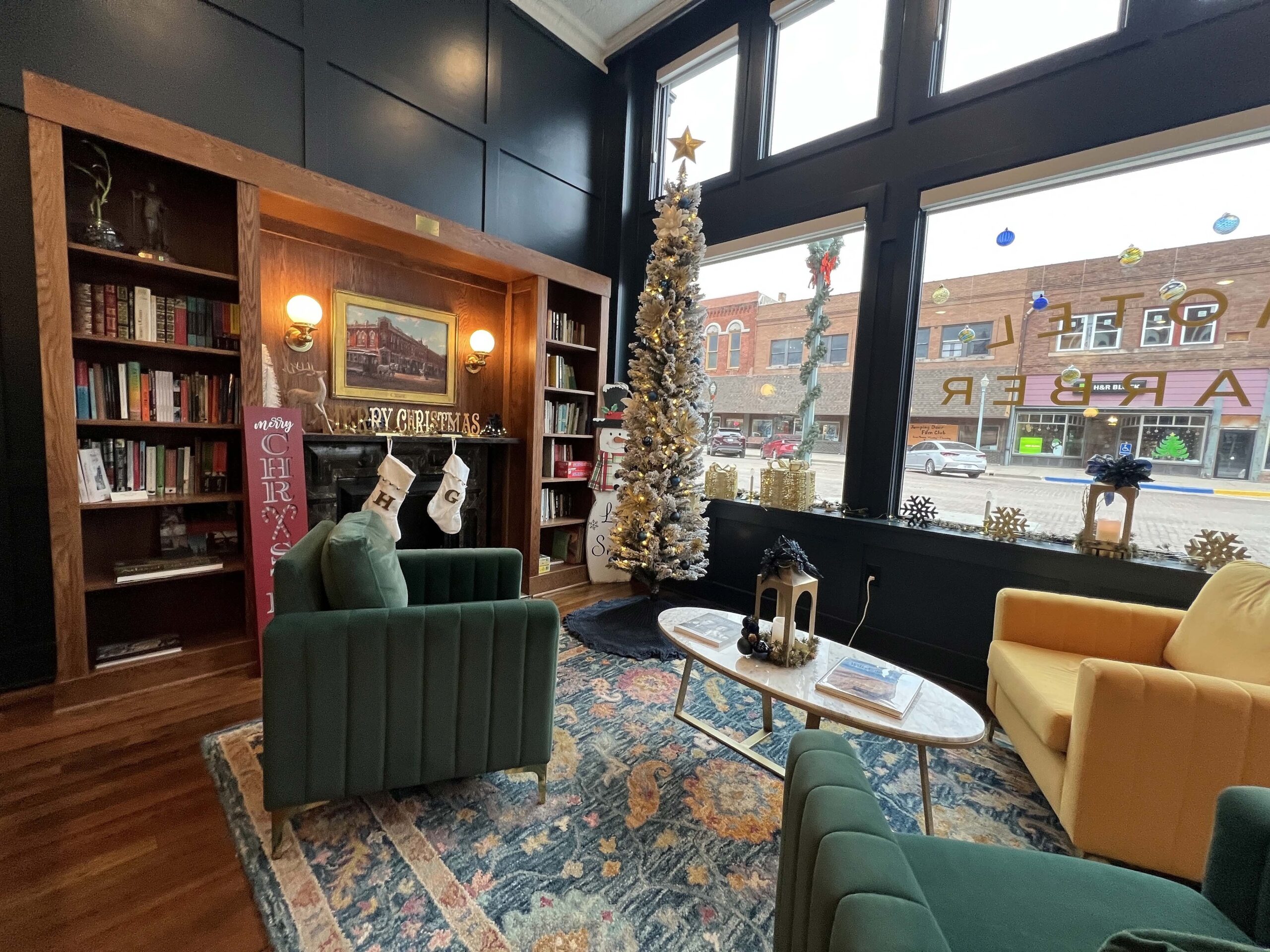 Hotel Garber's lobby is decorated for the holiday, including stockings on the mantel. 