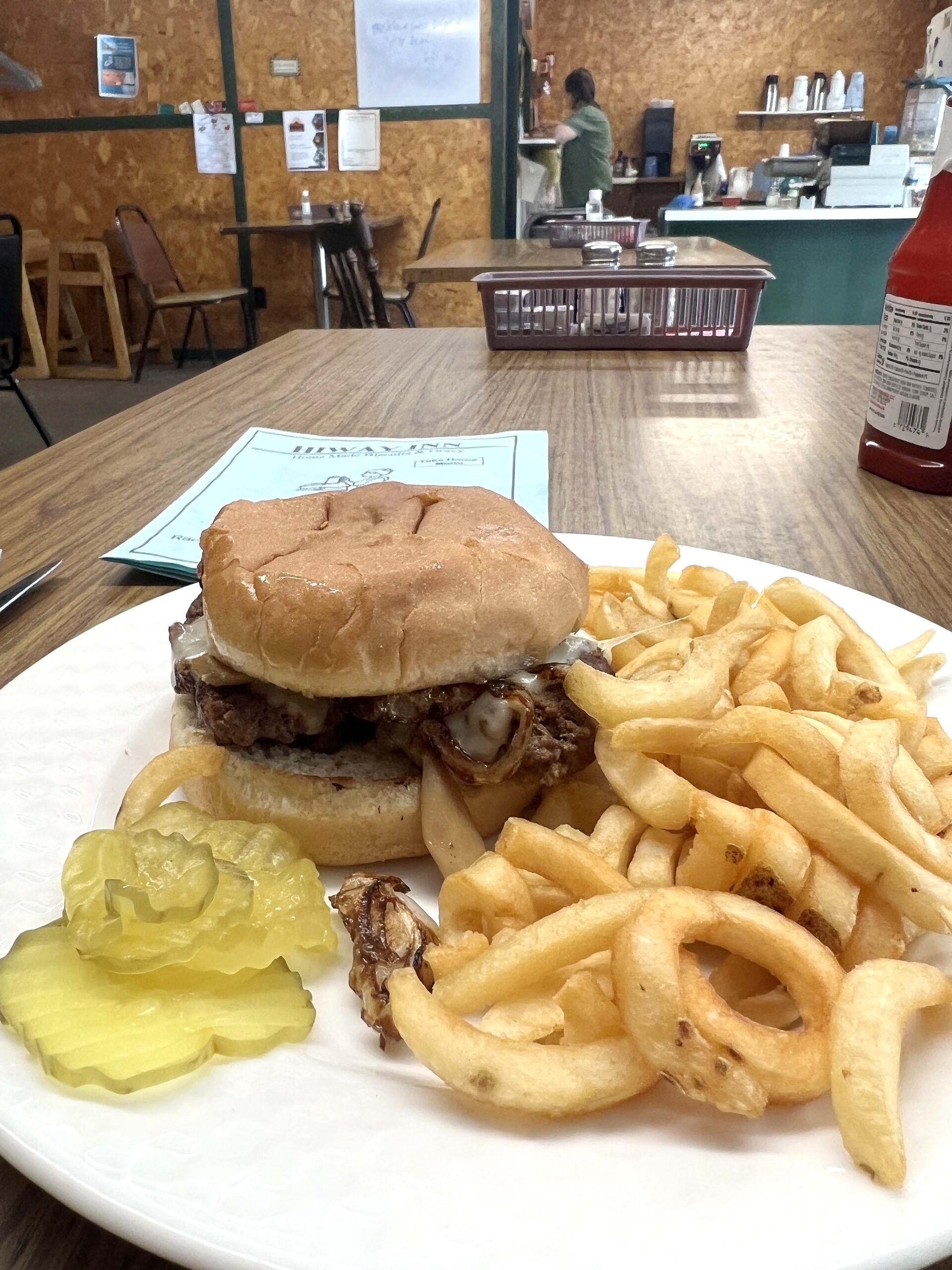 The daily special featured a mushroom Swiss cheese burger with curly fries. 
