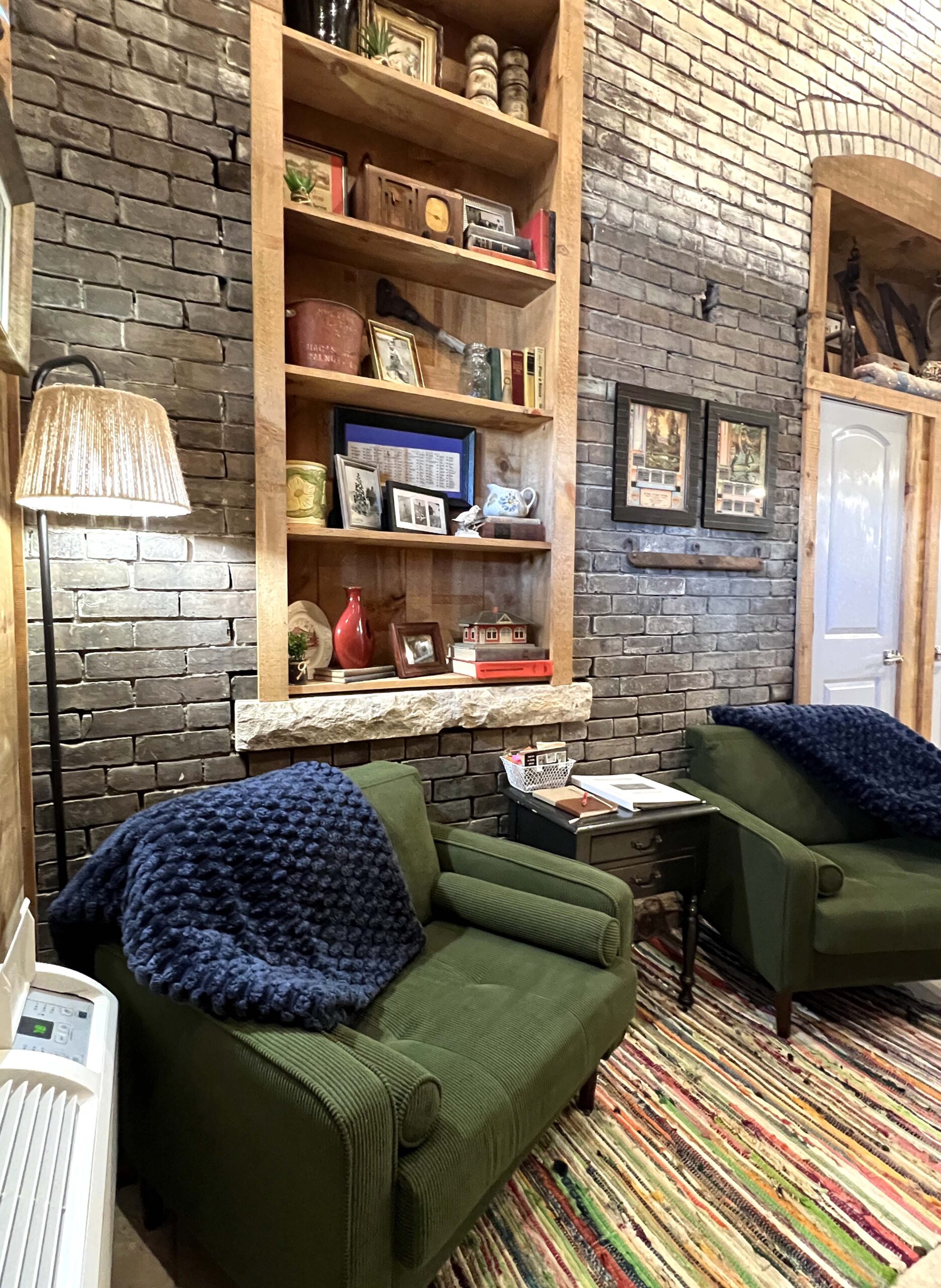 The seating area is across from a mounted television with access to streaming channels.