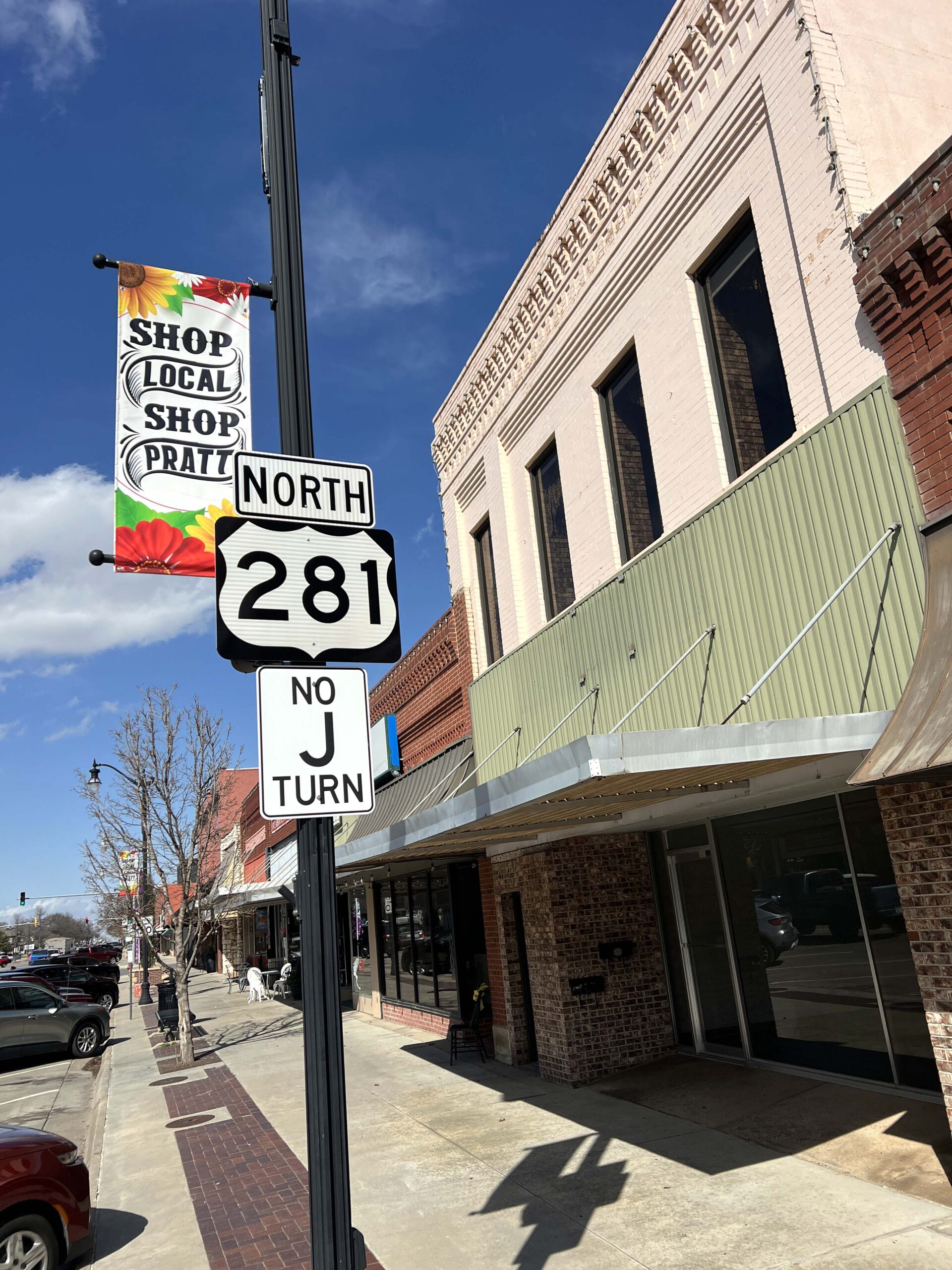 Pratt Main Street signage encourages local shopping. 