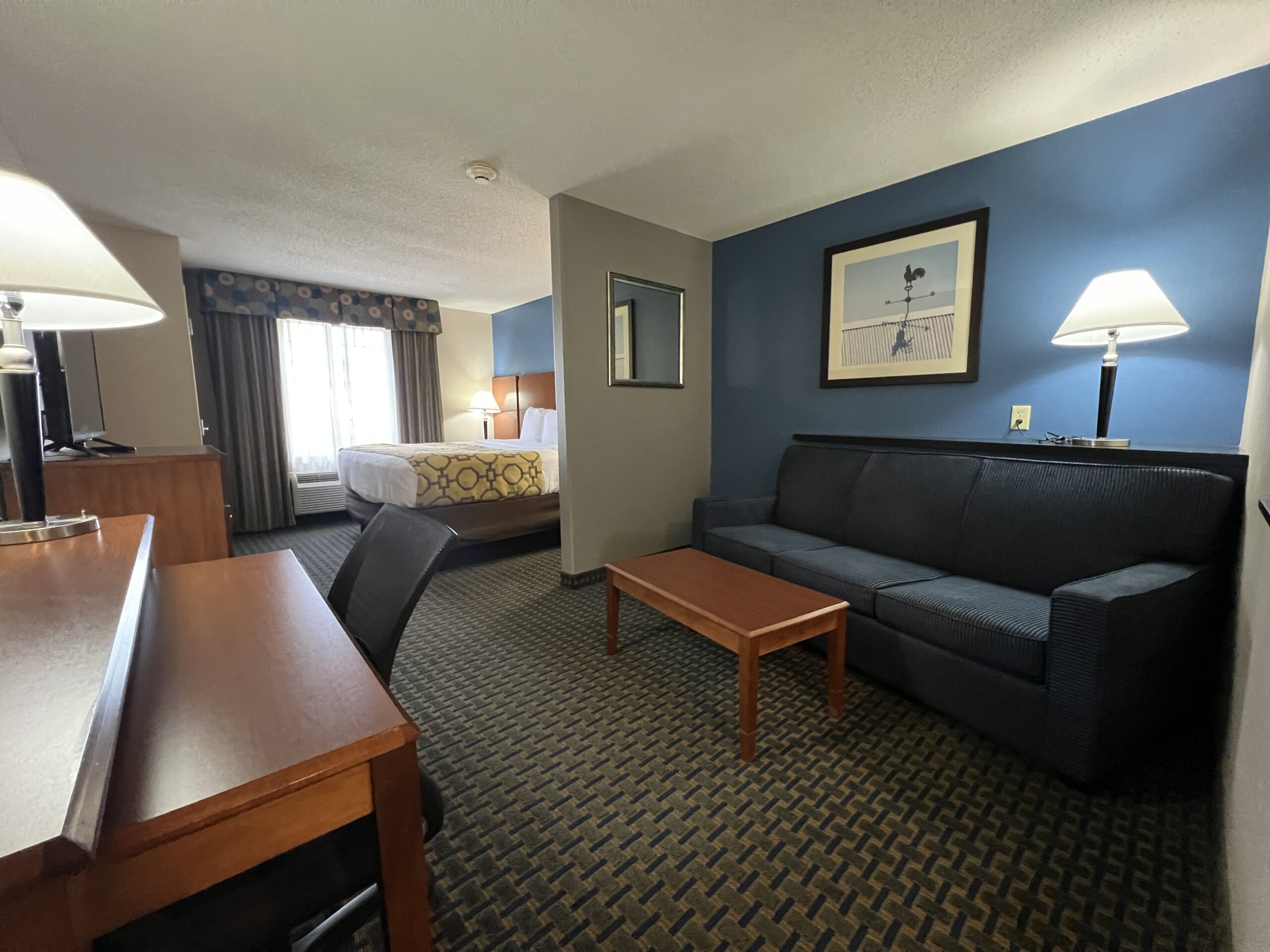 The King Suite comes with a small kitchenette, living room space, and work desk. 