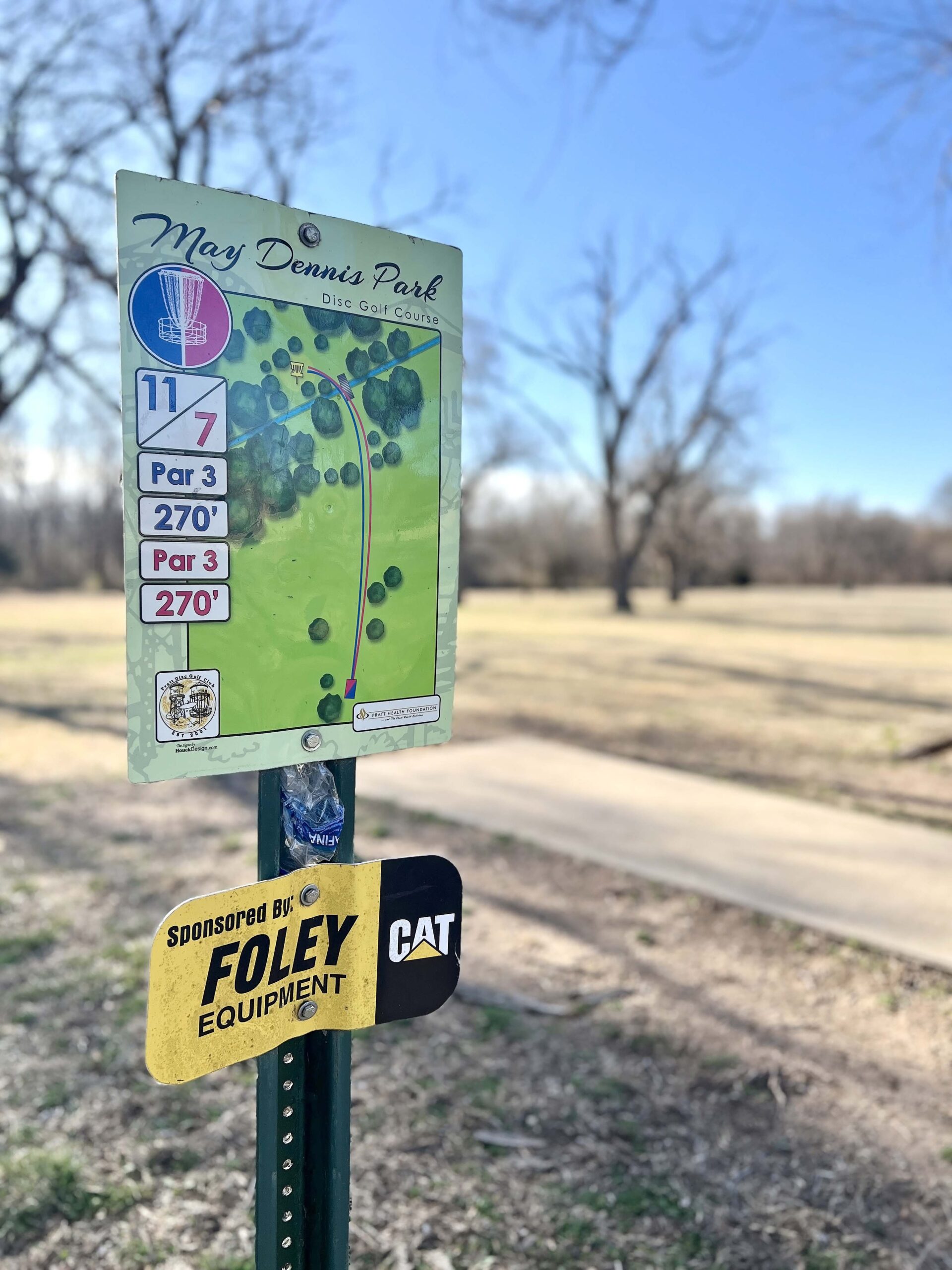 Mae Dennis Disc Golf Park includes concrete pads and well-marked baskets.