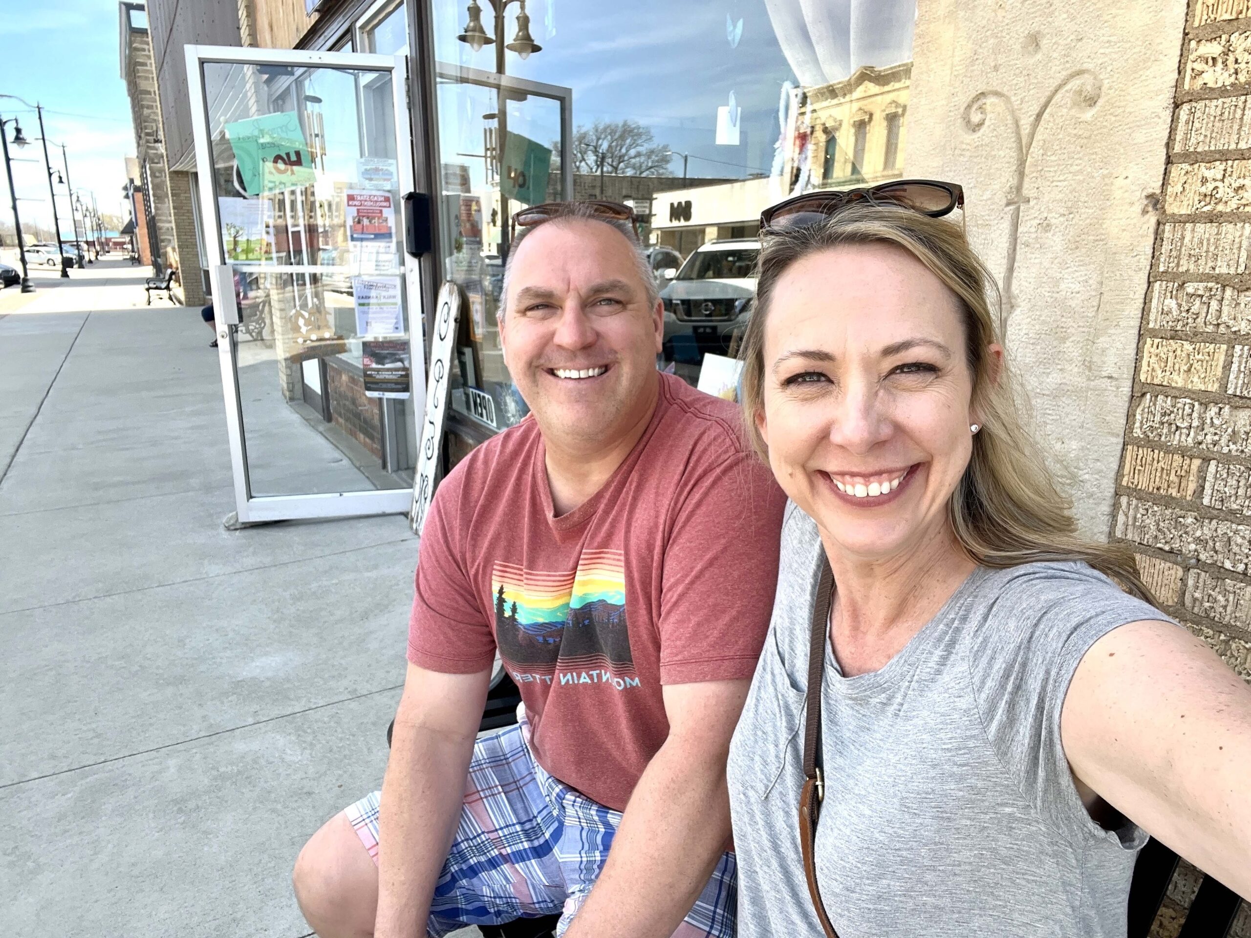 Pausing from shopping in Marion, Kansas, travel blogger, One Delightful Life, takes a selfie. 