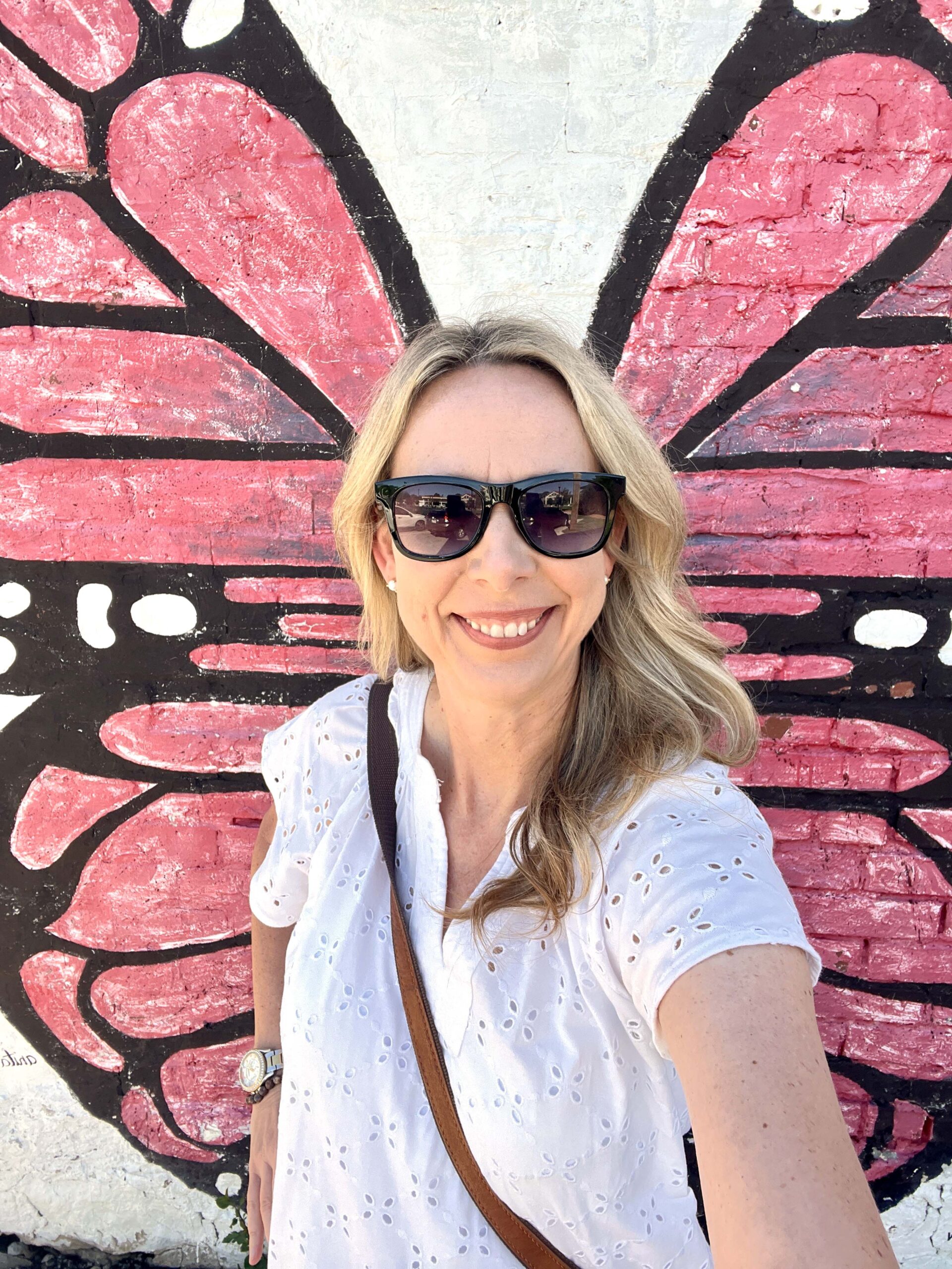Selfie at butterfly mural in alleyway off of Main Street in Ottawa, Kansas