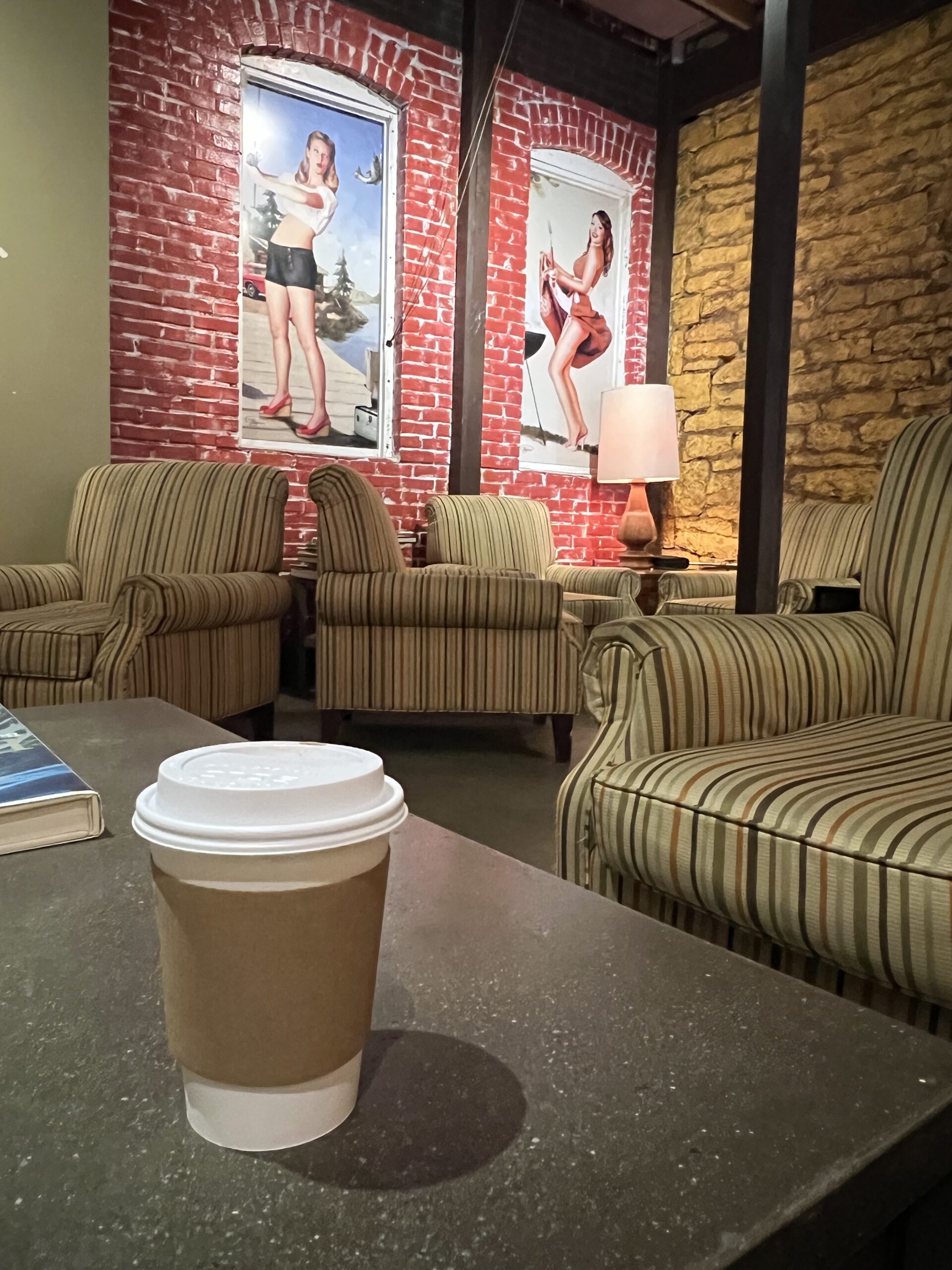 Plush furnishings in the back of Mug Shot Coffee make for comfortable lounge areas.