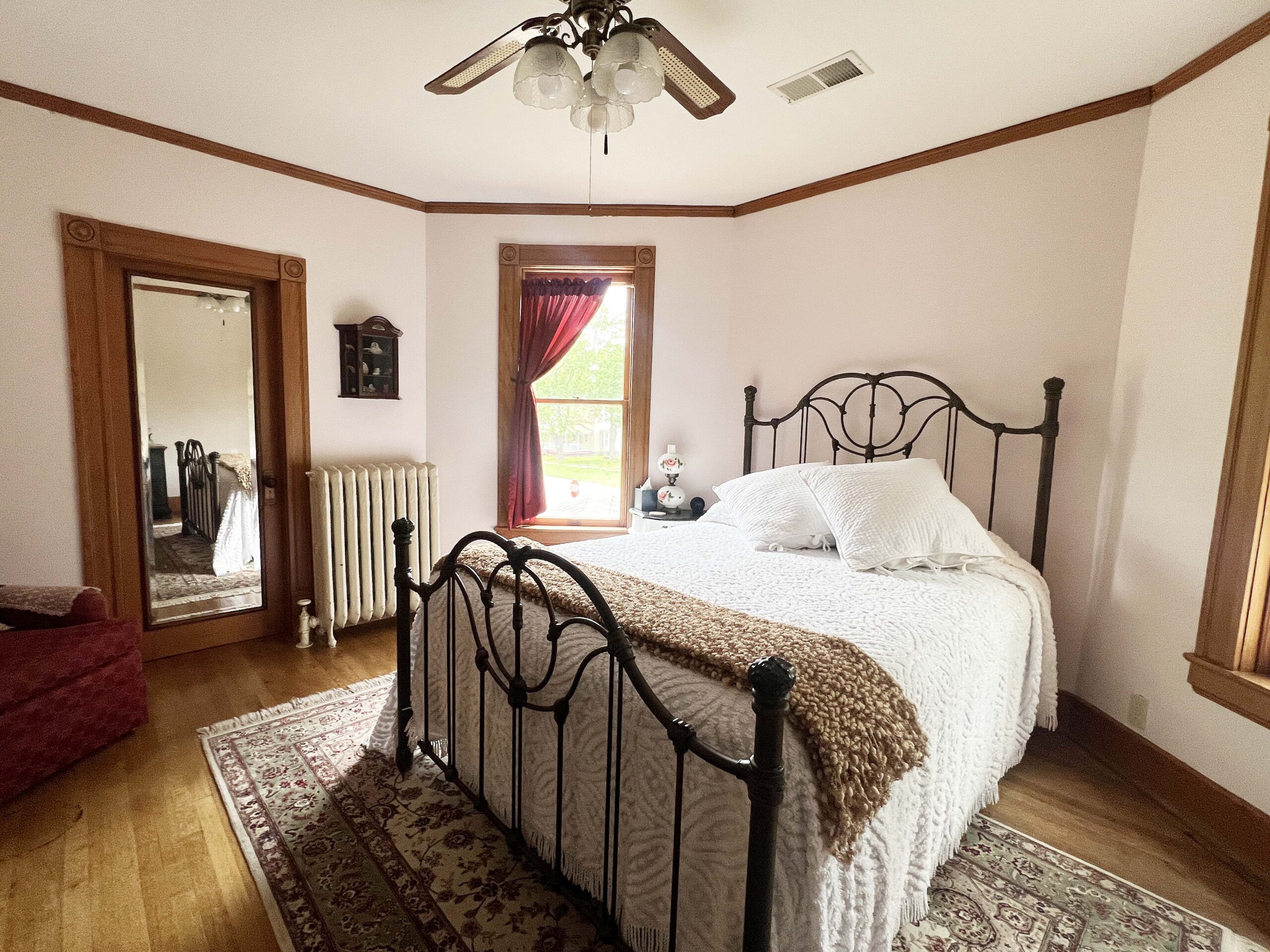 The Tulip Bedroom upstairs at The Painted Lady Bed and Breakfast sleeps two adults.
