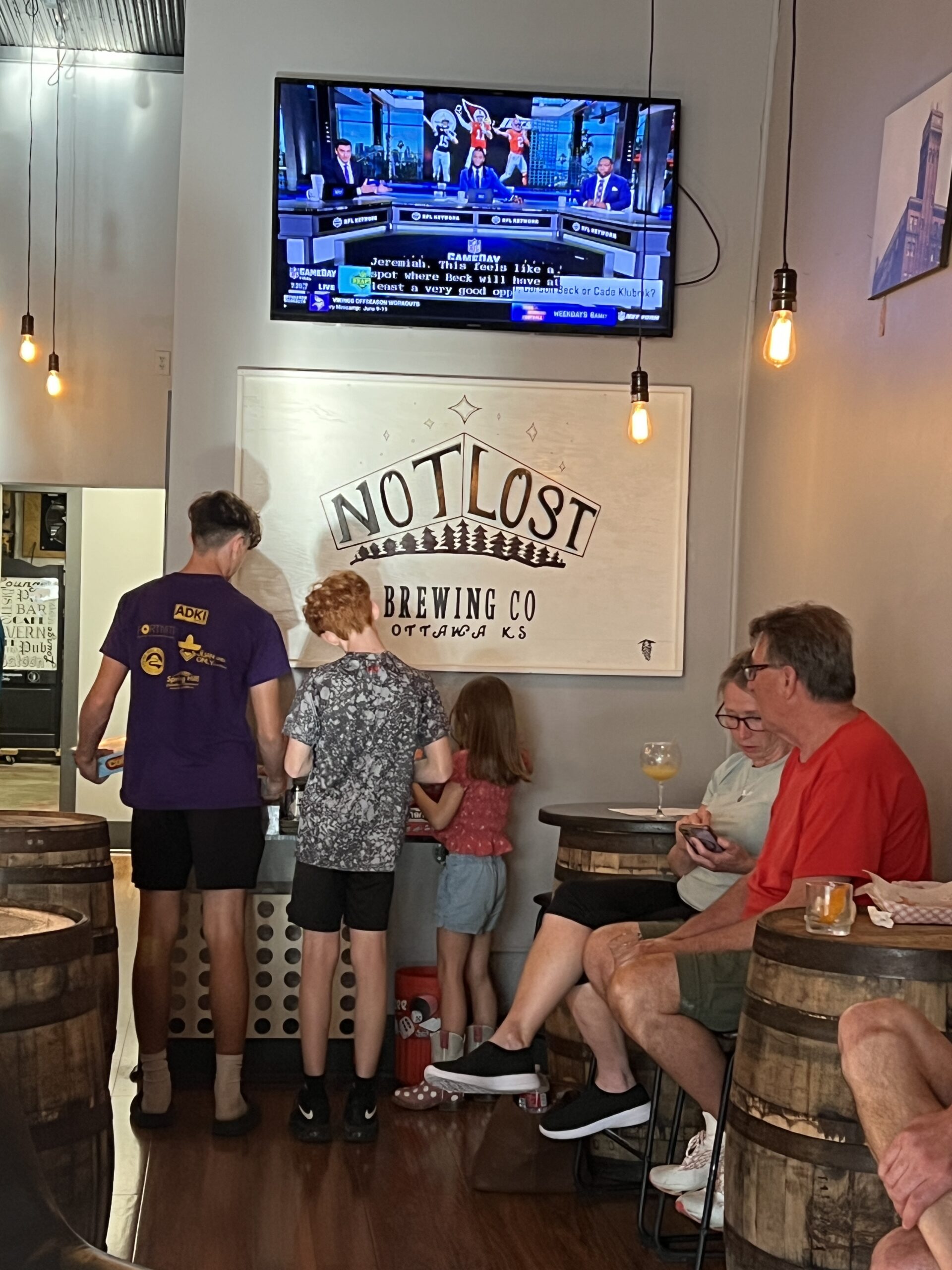 Kids look for a game to play at Not Lost Brewing Company in Ottawa, Kansas.
