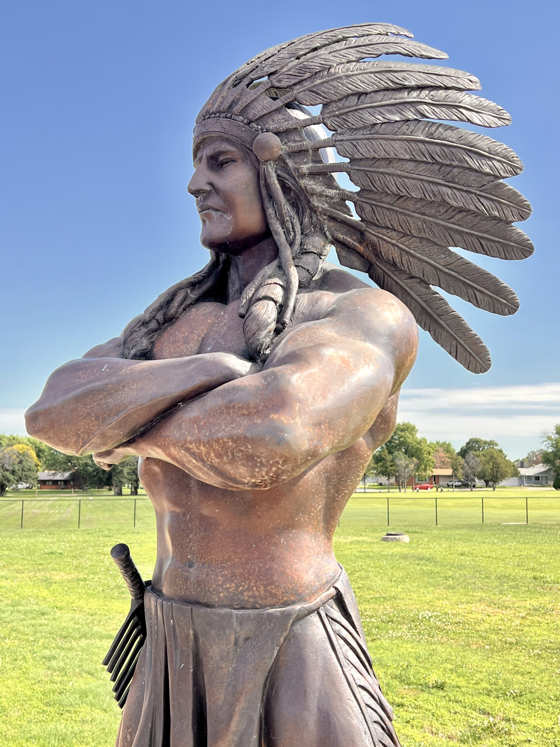 Larned High School's mascot is represented by a bronze sculpture facing the sports field.
