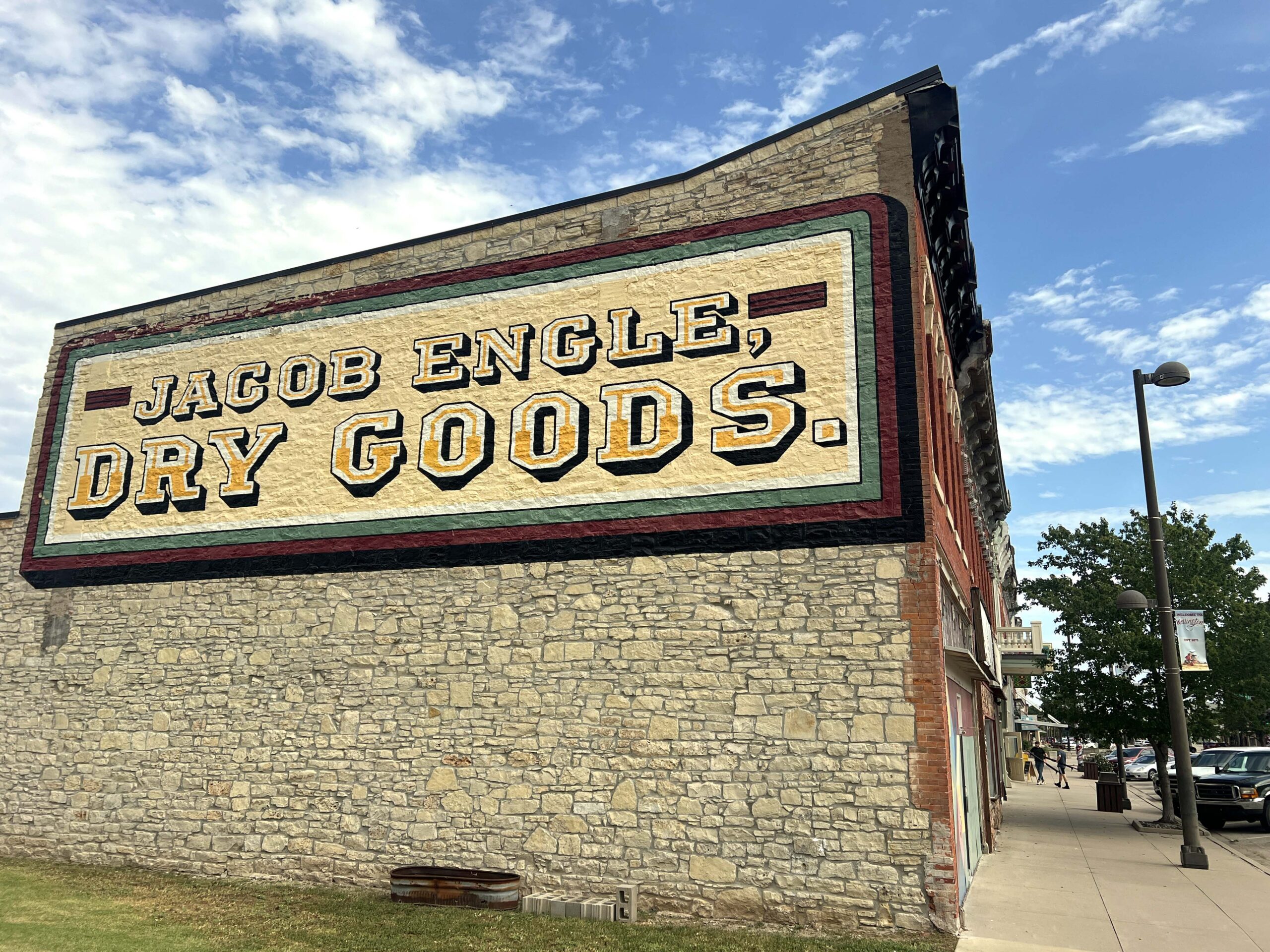 The Jacob Engle Dry Goods sign at the corner of Washington Avenue and Lincoln Street was recently restored for Wellington's 150th anniversary.