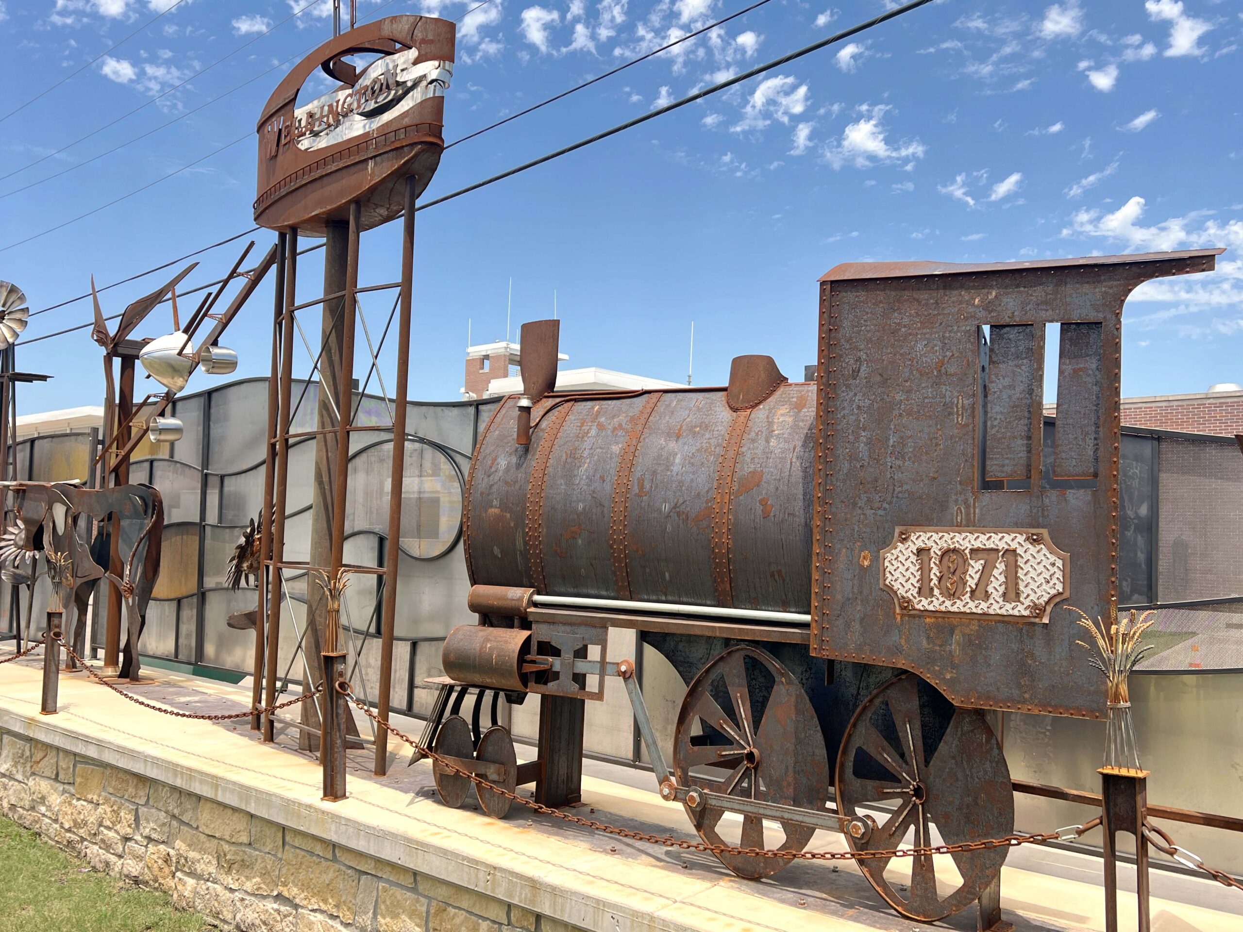 Wellington's newest art installation, located at Heritage Plaza on the former Antler's Hotel Lot, was dedicated in 2025 to represent the city's heritage