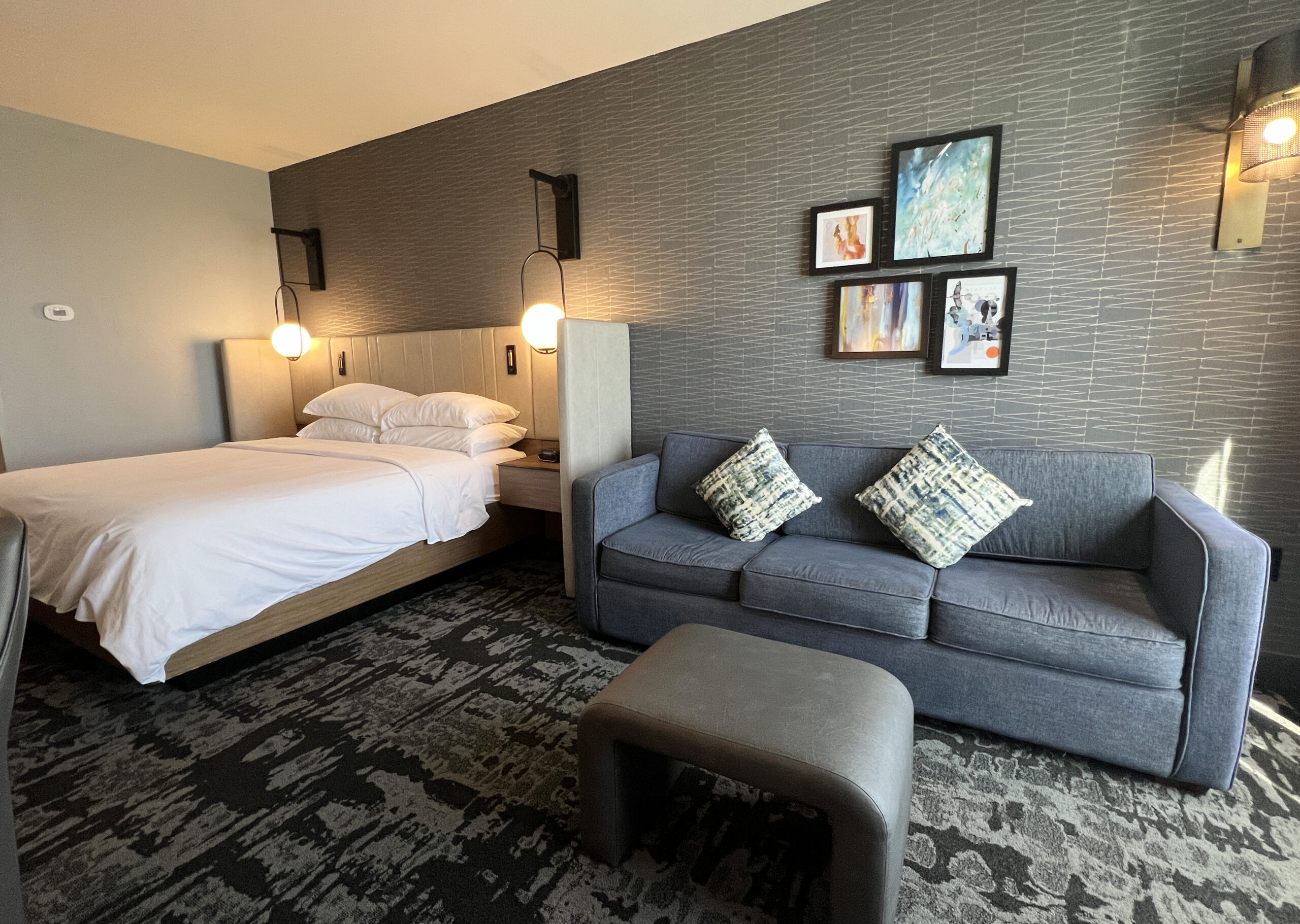 The King Standard bedroom at the Crowne Plaza Kearney has a pull-out sofa and plenty of room for a family. 