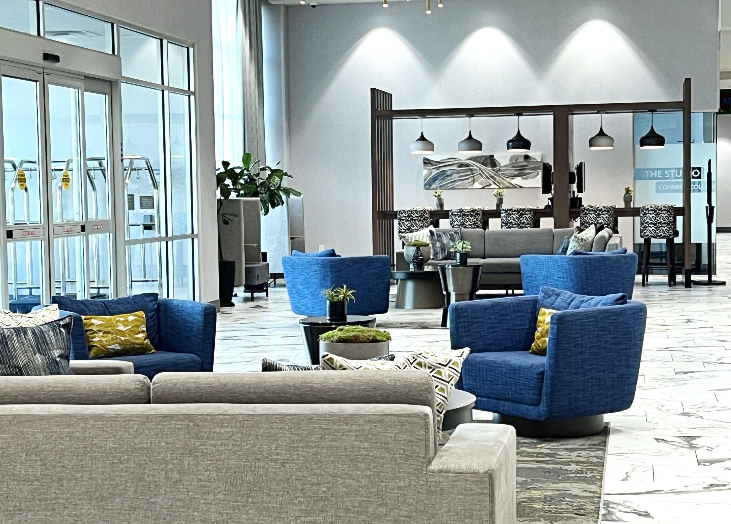 Crowne Plaza Kearney lobby includes modern furnishings with ample space to lounge.