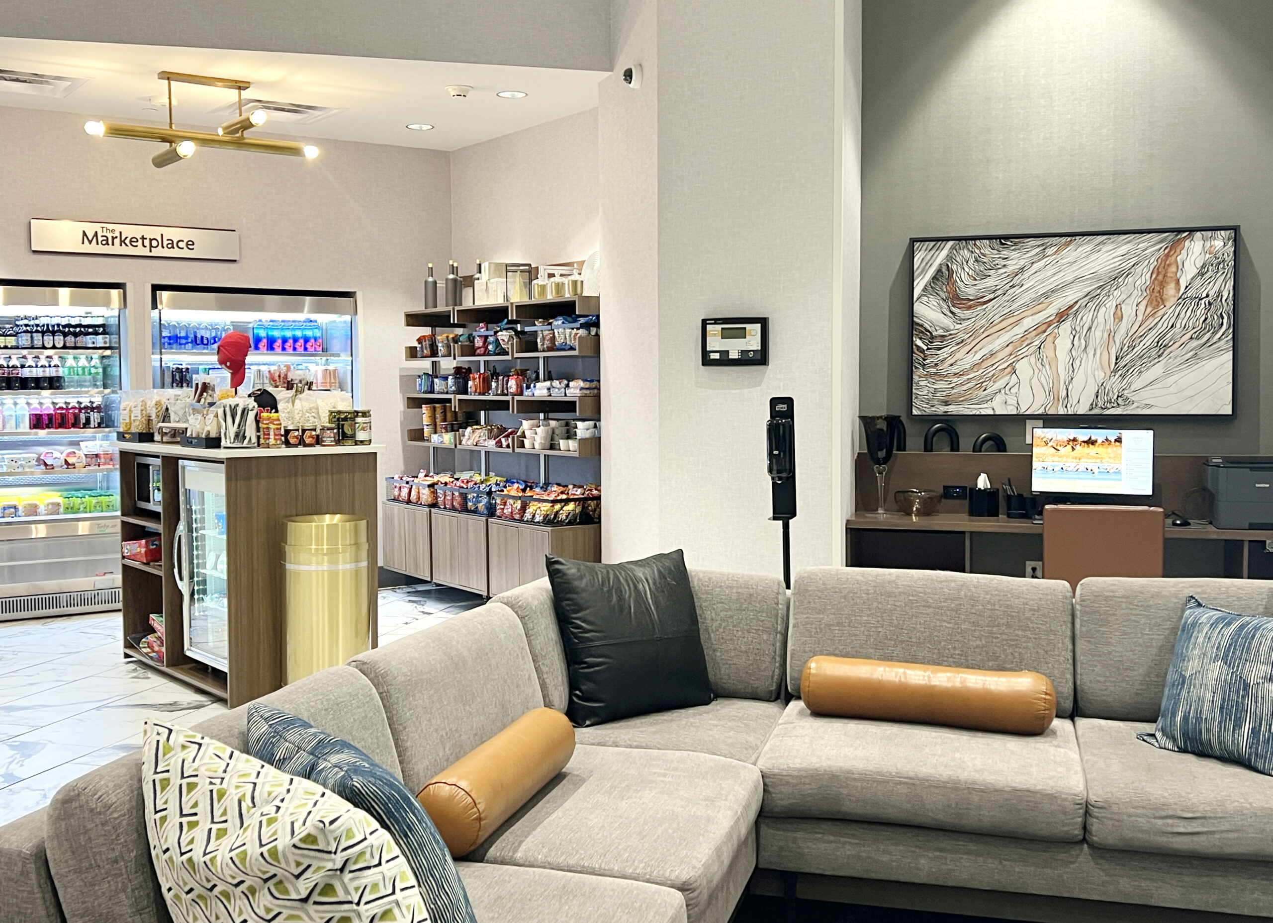 The Crowne Plaza Kearney lower level includes a grab-and-go snack and beverage area and a workstation.