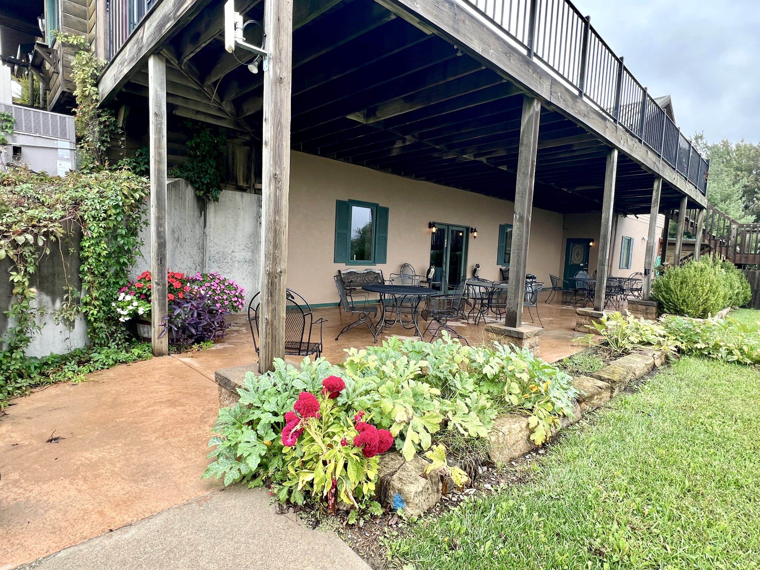 The lower level of the restaurant includes an bar exit onto a deck overlooking a pond. 
