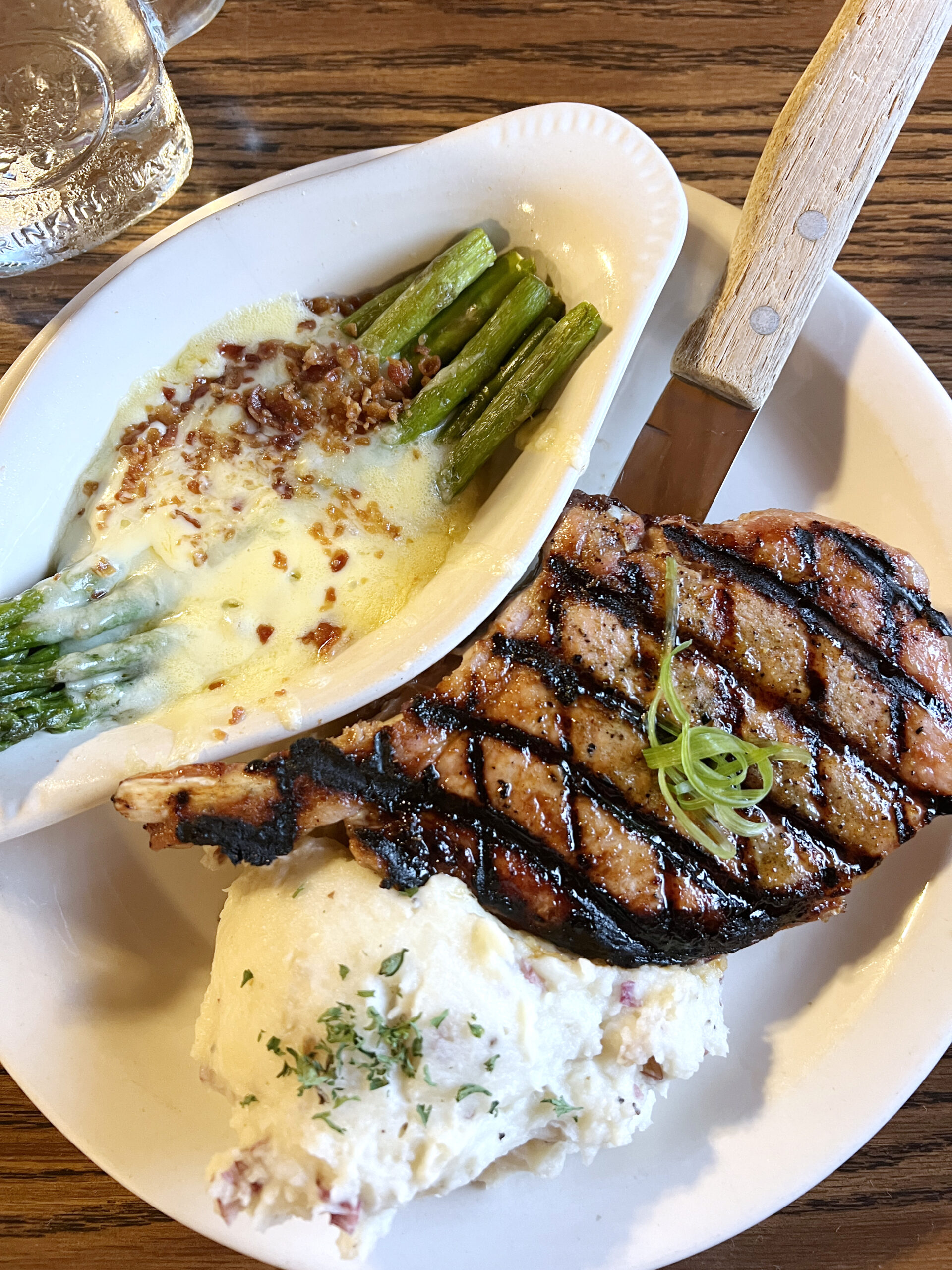 A grilled pork chop served with red skin mashed potatoes and asparagus are highlights of the fall menu at The Country Cabin.